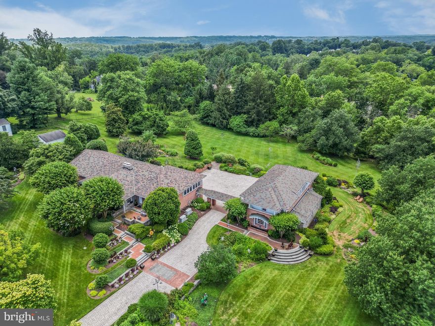 Welcome to 6 Seminole Road, a truly magnificent property in Catonsville, offering a rare combination of a sophisticated main residence and a charming guest-ready studio apartment. This expansive estate is set on a spectacular landscape, creating an unparalleled living experience.
The Main House:
Step into elegance in this beautifully appointed main house, featuring 3 bedrooms, 2 full bathrooms, and a convenient half bathroom on the main level. The home boasts a grand living room, warmed by a gas fireplace, perfect for cozy evenings. A separate family room, complete with custom built-ins, provides ample space for relaxation, while a dedicated den/study offers a quiet retreat for work or contemplation. Entertain in style in the formal dining room, setting the scene for memorable meals.
The heart of this home is the pristine, (practically) never-been-used kitchen, a true chef's delight. It features an electric range, two-drawer dishwasher, and a top-of-the-line Jenn-Air refrigerator with a freezer drawer below, all seamlessly integrated with cabinet-matching fronts. A sleek island offers a perfect spot for casual dining and is complemented by a breakfast room.  
The private primary suite is a sanctuary, featuring a spacious bedroom and a beautiful en suite bathroom. Two additional well sized bedrooms and a hallway bathroom provide comfort and convenience. A unique highlight is the stunning dressing room (previously a bedroom). 

The enormous lower level is an entertainer's dream, offering a sprawling recreation room complete with a second gas fireplace and an additional bathroom. This level also provides access to the connected two-car garage, offering abundant storage space.
Throughout the first floor, exquisite plantation shutters add a touch of classic charm, while recessed lighting illuminates the living spaces, showcasing the gleaming hardwood floors. Comfort is assured year-round with a 4-zone HVAC system. Practical updates include a new roof installed in 2005, conveyed with a 25-year warranty, and two dedicated generators, ensuring seamless power for both the main house and the guest house.

The Guest House:
Beyond the main residence lies a private, studio-like guest apartment. This inviting space boasts beautiful hardwood floors, a convenient kitchenette, and a full bathroom. An abundance of windows floods the interior with natural light, creating a bright and airy atmosphere. Enjoy serene views of the property from the private balcony. Beneath the guest house is an impressive three-car garage, providing extensive parking or workshop space.

The Grounds:
The exterior of 6 Seminole Road is nothing short of magnificent. The property features meticulously designed gardens and inviting patios, adorned with magazine-worthy art sculptures, creating a breathtaking outdoor oasis for relaxation, entertaining, and enjoying the beauty of nature.
This extraordinary property in Catonsville is the perfect blend of elegant living, versatile guest accommodations, and stunning outdoor spaces. Don't miss this unique opportunity!