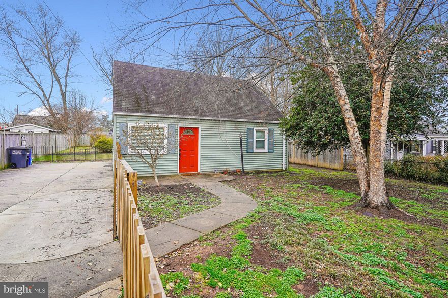 Charming two-level Cape Cod in the heart of Manassas Park, with a lovely yard. Move-in ready with updates throughout — new kitchen tile flooring (2024), HVAC (2024), hot water heater (2024), updated driveway and fencing (2022), and a modern kitchen with stainless steel appliances and refrigerator (2022). Bright living room with lots of natural light and luxury vinyl plank flooring on the main level. Two bedrooms and a full bath on the main floor, plus a versatile upper level perfect as a third bedroom, home office, or bonus space. Large, flat, fully fenced backyard with landscaping and storage shed — ideal for entertaining, gardening, or play. School bus stop right out front. No HOA. Walkable to restaurants, grocery shopping, and the farmers market at City Hall. Manassas Park is in the midst of an exciting downtown transformation — Park Central, the city's new mixed-use town center, features the new City Hall, public library, splash pad plaza, Cinema Café theater coming soon, and new dining — all adjacent to the VRE commuter rail station just 1.2 miles away. Old Town Manassas is 10 minutes away.