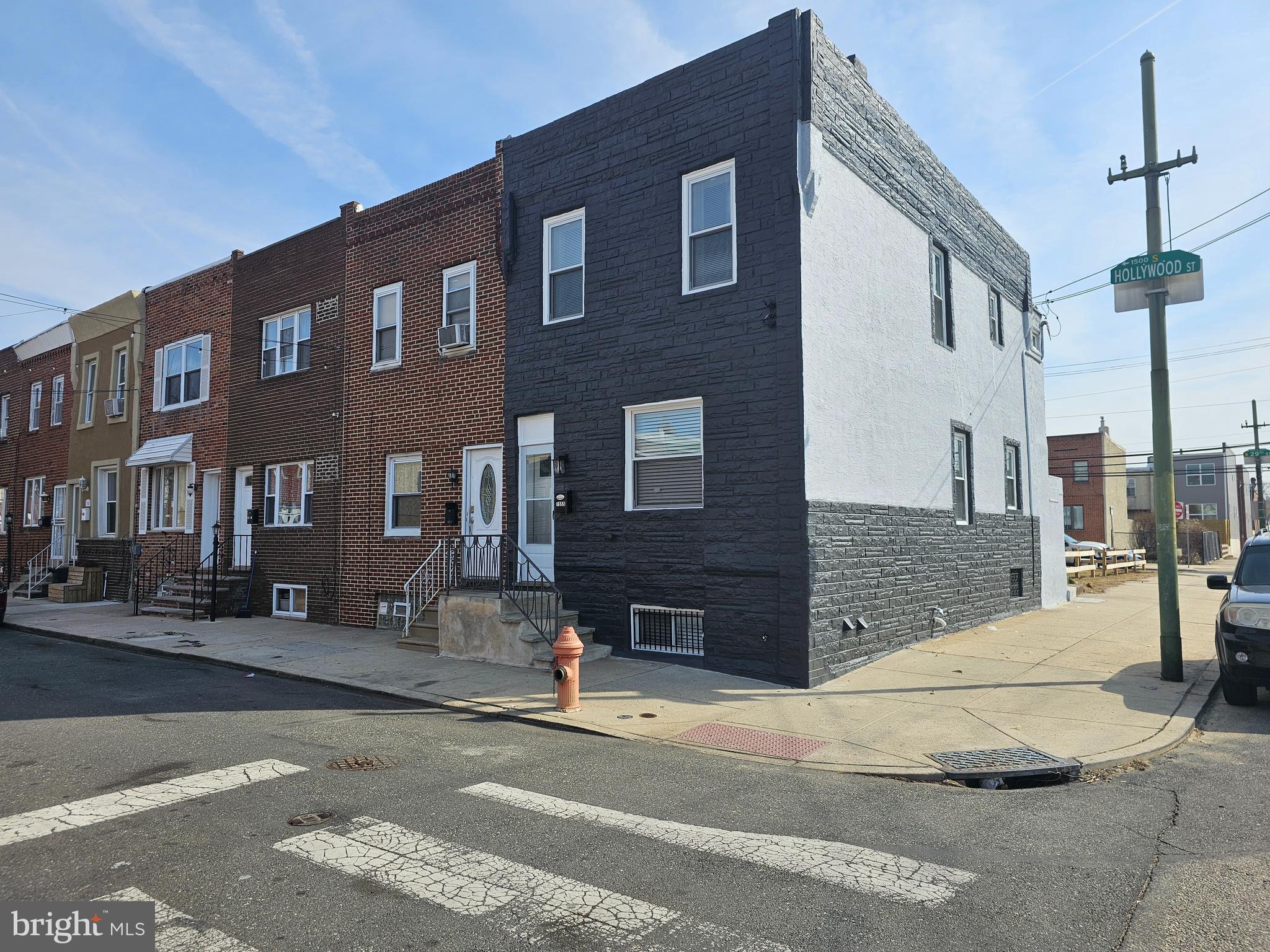 Welcome to 1555 S Hollywood Street. This Corner Home Sweet Home has been totally custom upgraded inside-out with the highest level of craftsmanship and quality. Stunning Beauty 3 Bedrooms & 2 Full Baths Townhouse nestled in the vibrant Grays Ferry neighborhood of Philadelphia, a fantastic neighborhood next to the border of a massive growing development of UPENN & DREXEL & UCITY area. You'll live, filled with comfort and convenience all blended perfectly. Take advantage of super easy access to UPENN & DREXEL & UCITY, It is only about a few minutes from Center City of Philadelphia & Stadium & Live Casino. This remarkable and luxurious home offers 3 beds and 2 baths is truly exceptional. Right after you're passing the beautiful front, you'll see super generous open lay out of the entire home, Straight forward you'll find a massive size of living room. This home is very excellent, super clean and naturally filled with sun light plus tons of recessed lighting throughout, all matched high quality type of flooring material perfectly blended with gorgeous shiny of wood flooring for the entire home. Fully upgraded kitchen complete with full size of breakfast island table, counter top, stainless steel appliances package, beautifully matched back splash also tons of kitchen cabinetry. Smoothly accessible to the fully fenced, private rear yard. Upstairs of this immaculate home offer generous size of master bedroom, as well as the other two bedrooms and a full bath has been totally upgraded. Downstairs level has a full of finished basement could be used as a family room and/or storage area lead to laundry area and a full size of bathroom. All a brand new mechanical system, central HVAC, Roof. This townhouse is located in front of the Lanier Playground, Pet-Friendly Park & Plenty of parking spaces.