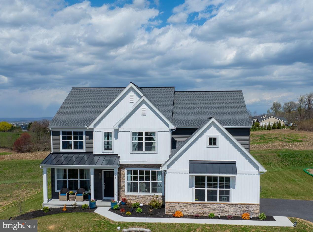 Welcome to this exquisite former model home, nestled in the historic town of Schaefferstown, Pennsylvania. This charming village boasts a rich history and a unique blend of traditional and modern amenities.
This stunning property has undergone extensive upgrades, totaling over $152,000. The meticulous attention to detail and luxurious features are evident throughout this masterfully crafted 4-bedroom, 2.5-bath home.
Surrounded by picturesque mountains and expansive farmlands, this property offers breathtaking views and a serene atmosphere. Its proximity to Lititz, PA, provides convenient access to local amenities.
With 3,349 square feet of living space, this home boasts an impressive kitchen, complete with an oversized island, ample storage, and high-end finishes, including quartz countertops, tile backsplash, and a farmhouse sink. Additional features include a butler’s pantry, complete with wet bar, and elegant formal dining room.
The main level also includes a bonus room, perfect for use as a, gym, or play area, my entrance ,when you walk to hallway, you will find a spacious office with abundant natural lighting. A mudroom, and upgraded walk-in pantry, are conveniently located near the garage entrance. The open family room features a gas fireplace and is adjacent to the kitchen.
Throughout the house, you’ll find upgraded large windows, allowing an abundance of natural light to pour in. The first floor boasts luxury vinyl flooring, 9-foot ceilings, and upgraded wide baseboards.
The upper level is accessible via a beautiful staircase, leading to a spacious loft area, perfect for quiet family time. Four generously sized bedrooms, each with walk-in closets, share a doublesink full bath. The master suite boasts an expansive walk-in closet, tray ceiling, and a luxurious master bath, complete with a standing tub, double vanity, and tile shower.
Step outside to enjoy the patio, offering stunning views of the surrounding farmlands. This private and peaceful setting provides the perfect retreat from the stresses of everyday life. A larger basement awaits your personal touch, while the two atached side-load garages and street parking provide ample parking options.
Copper Ridge neighborhood is located in historic Schaefferstown, this home is part of a charming village atmosphere, complete with a central square and numerous architectural beauties. Popular attractions, such as the Brindle Museum and Alexander Schaeffer’s farm, are nearby. Additional nearby attraction include the Middle Creek Wildlife Management Area, a popular spot for birdwatching and nature activities, and Refreshing Mountain, offering hiking trails and scenic views. Mt. Gretna – a popular summer destination for its lake & beach, jazz concerts, live summer stock theatre.
Don't miss your opportunity to experience this beautiful property with spectacular surrounding views!
Schedule your private tour today!