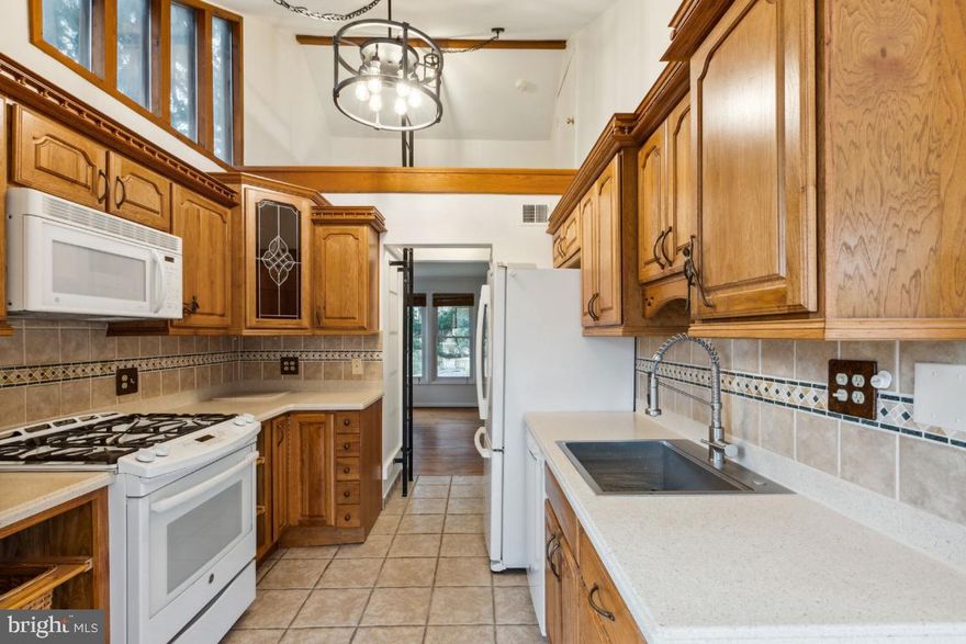 One level living at its best! Located in the City of Rockville, this charming 1950s rambler is freshly painted throughout and ready for your personal touch. Original hardwood floors in the living room, hall, and bedrooms and ceramic tiles in the kitchen and bath. Enjoy your morning coffee and meals in the tablespace kitchen overlooking the deck and fully fenced backyard. This home is close to EVERYTHING - shopping, schools, churches, bus stops, I-270, with quick access to both the Twinbrook and Rockville Metro Stations and the MARC train. No HOA!

New kitchen sink with accessories and fabulous new lighting in the kitchen make for a bright work space for cooking your favorite dinners.  Above the kitchen is the most unique feature - a cozy loft, perfect for reading or decorating. The attic is accessible from the loft and  houses the hot water heater and air conditioning unit with plenty of space for storage.

Stackable washer/dryer was replaced in spring 2023. Roof on both house and shed was replaced in December 2020.