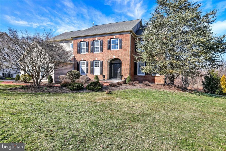 Welcome to 1283 Clearwater Drive, located in the highly sought-after community of Clearview Estates in Yardley, PA. This elegant 5-bedroom, 3.5-bath “Windsor” model features a classic brick façade, an oversized three-car side-entry garage, and a ver private back yard with open and wooded views.  A curved brick walkway leads to the inviting covered bluestone front porch, creating a warm and sophisticated entrance. The impressive two-story foyer welcomes you with ceramic tile flooring, upgraded moldings, and a turned oak staircase with a custom runner. Double glass doors open to a private office featuring hardwood flooring, crown and dentil moldings, recessed lighting, and custom plantation shutters. The adjacent living room includes a dry bar, newly installed engineered hardwood flooring (3/12/2026), recessed lighting, crown and dentil moldings, and plantation shutters, creating a refined space for entertaining. The formal dining room showcases crown, chair, and dentil molding along with a large bay window offering scenic views. The chef’s kitchen is beautifully appointed with upgraded cherry cabinetry with under-cabinet lighting, granite countertops, a double undermount stainless steel sink, and a subway tile backsplash. Stainless steel appliances include a KitchenAid five-burner cooktop, Frigidaire double-wall ovens, dishwasher, Gallery French-door refrigerator, and GE microwave. The center island with seating offers additional cabinetry, granite countertops, and two custom pendant lights. The adjoining breakfast room, with a garden bump-out, provides access through a glass door to the expansive maintenance-free Trex deck (2016) overlooking peaceful, private views. The sun-filled two-story family room features a dramatic wall of windows, random plank engineered hardwood flooring, and a stunning floor-to-ceiling stone gas fireplace with custom millwork. A main-level laundry room and powder room complete the first floor. Upstairs, the hallway features random plank hardwood flooring, a linen closet, and a loft area. Double doors lead to the luxurious owner’s suite, highlighted by a vaulted ceiling, two spacious walk-in closets, and an expansive sitting area currently used as a second office. The recently renovated owner’s bath (2023) offers a double walk-in shower with a seamless farmhouse sliding glass door, American Standard freestanding oval tub, dual vanities, and a private water closet. Three additional well-appointed bedrooms and a full hall bathroom with tub/shower complete the upper level. The refinished daylight walk-out basement (2019) provides exceptional additional living space, including a large recreation/media room with luxury vinyl plank flooring and French doors leading to a spectacular EP Henry patio with custom retaining wall and built-in fire pit (2020). A spacious game room enhances the entertainment area. The conditioned wine storage room with custom racks offers ample storage for wine enthusiasts. A pocket door leads to the fifth bedroom, complete with a private sitting area, along with a full bathroom featuring a large walk-in shower and ceramic tile flooring.
An additional 460 square feet of storage and mechanical utility space completes the lower level. Additional highlights include a newer dual-zone A/C  system (2021) and an EP Henry walkway connecting the driveway to the rear patio and deck areas, along with many other thoughtful upgrades throughout this exceptional home. For outdoor and fitness enthusiasts, Makefield Highlands Golf Club is just steps away, while the scenic Delaware Canal towpath, less than two-tenths of a mile from the community, is easily accessed via a safety path. Tyler State Park is also just five miles away, offering miles of trails and natural beauty. Clearview Estates is minutes from the charming boroughs of Yardley & Newtown. Convenient commuter routes provide easy access to Philadelphia, Princeton, and New York City. This exceptional home is impeccably maintained!