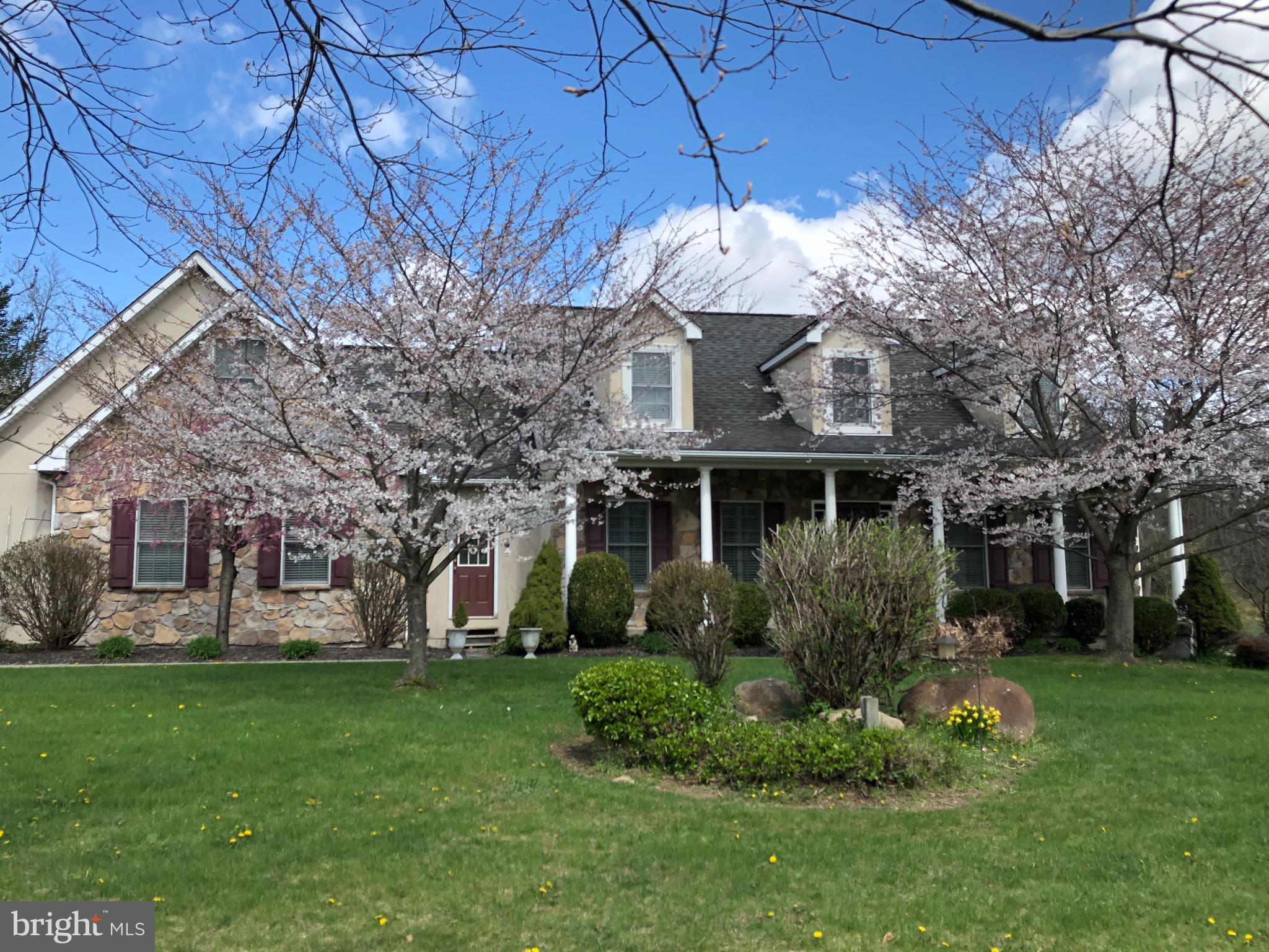 Beautiful Parkland ranch in North Whitehall on 2.8 acres is your last stop! Traditional, yet modern 5 bed/2.5 baths, with large rooms is an entertainers dream! Enter the foyer w/vaulted ceiling you'll see a spacious LR featuring a gorgeous stone fireplace and gleaming hardwood floors. Centered around the living room/kitchen space the home is filled with natural light and overlooks a three tier deck and lush yard and woods. The first floor features lovely dining room and adjacent family room with french doors, two well appointed bedrooms and full bath; the master suite features vaulted ceilings, walk in closet and en suite, complete with Jacuzzi tub and private water closet. Upstairs is a large bedroom with attic storage. The walkout basement has the 5th bedroom, and 2230 sq.ft. of space; huge storage room and roughed in full bath. Outside, mature trees, a built in hot tub (perfect condition) and plenty of play or garden space. This home has it all - it just needs YOU!