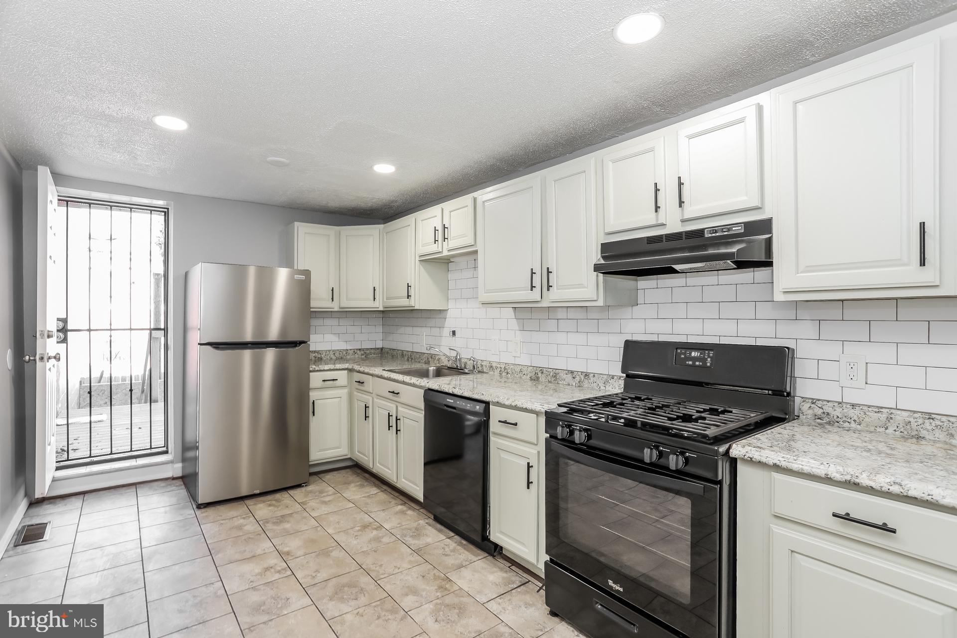 Price Improvement! Welcome to this charming, move-in ready Federal-style row home in the heart of Baltimore! This property would make the perfect addition to any investment portfolio or as a first home utilizing one of the many down payment assistance programs the area offers. Boasting 3 bedrooms, 2 bathrooms, and 1,764 sq. ft.. The spacious living room features high ceilings, recessed lighting, and fresh neutral paint. The updated kitchen showcases white cabinetry, subway tile backsplash, and gas cooking with direct access to the fenced-in backyard. Upstairs, you’ll find two bedrooms with large closets providing ample storage and a full bath with soaking tub. The finished basement offers flexible living space, a third bedroom, and full bath. Conveniently located just a few blocks from Patterson Park, with easy access to Johns Hopkins, Little Italy, and the Inner Harbor, this home has the perfect location—schedule your showing today!