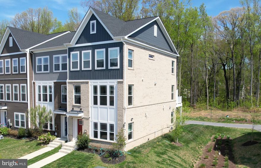 Welcome to this beautifully maintained end-unit townhome built in 2023 in the desirable community of Bryans Village. Designed with both style and functionality in mind, this modern home offers upgraded finishes, smart features, and peaceful outdoor living.
The bright and open interior features elegant white cabinetry with gold hardware, soft-close cabinets, stainless steel appliances, and a gas oven that will delight any home chef. The spacious formal dining room provides the perfect space for hosting gatherings or enjoying family meals.
Step outside to an impressive 18’ x 12’ Trex deck overlooking a serene trees and forest retention area, offering exceptional privacy and a peaceful natural backdrop—ideal for morning coffee or evening relaxation.
This smart, energy-efficient home also includes an oversized two-car garage with built-in storage, providing ample space for vehicles, tools, and organization.
Residents enjoy low-maintenance living with the HOA covering lawn care, snow removal, and trash service. Community amenities include walking trails, playground areas, a community garden, and a dog park, creating the perfect neighborhood for outdoor enjoyment and connection.
This nearly new home blends modern convenience, privacy, and community living—all in a prime Southern Maryland location.
