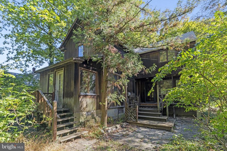 Welcome to this unique home tucked away in the heart of the Arborlea neighborhood of Lower Makefield Township, Yardley. This unique property sits on just over 2 acres of land surrounded by trees and nature giving it the peaceful feel of a cabin retreat. Perfect for investors or developers looking for their next project, this property offers endless possibilities. As you approach, you’re greeted by a wooden front porch with an additional side entrance and foyer. Step inside to find a cozy living room with sliding doors that open to a back deck, a kitchen, bathroom, storage area, dining space, and bonus area all on the main level. Upstairs features three nicely sized bedrooms, bathroom, laundry area, and extra hallway closets for storage. Outside, enjoy the heated and electrified shed workspace, a wooden pergola with a built-in swing, and plenty of open space to bring your vision to life. With the amount of land available, you could explore more options such as subdividing the property to build additional homes, or expanding the current structure for the potential is truly limitless. Schedule your showing today and imagine the possibilities this property has to offer. Bright MLS#