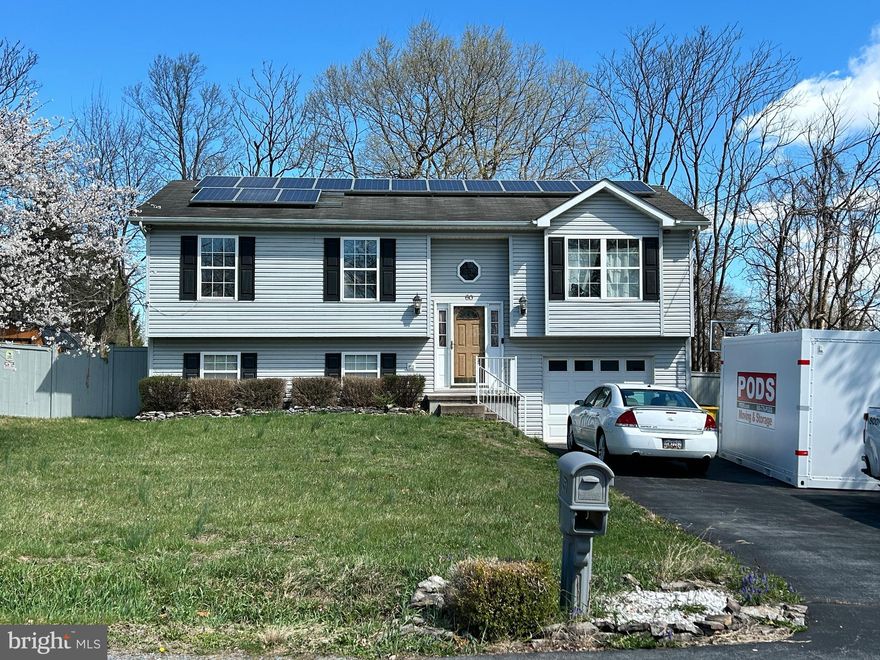 Tucked on a premium corner lot and backing to a peaceful tree-lined setting, this spacious split foyer offers the perfect blend of comfort, efficiency, and privacy.  Inside, a classic and functional layout welcomes you with a seamless flow between the kitchen, dining, and living areas. The kitchen is fully equipped with warm oak cabinetry and a convenient pantry closet. The main level features three bedrooms, including a relaxing primary suite with a beautifully updated en-suite bath and private access to the rear deck—ideal for morning coffee or evening unwinding.  Downstairs, the finished lower level provides a cozy yet versatile family or recreation space, highlighted by a pellet stove, custom stone accent wall, and recessed lighting —perfect for entertaining or relaxing nights in. A laundry/storage room and rough-in for a future bathroom add even more potential.  Outdoors, you can let your pets roam freely in the full fenced backyard that backs to trees and adjacent to vacant lot (used for storm management).  There's a nicely sized deck that spans the entire length of the home in the back, overlooking the sizeable backyard. Only minutes to the main highway which means you're only minutes from schools, shopping, community events and more.  Please schedule your tour to see this great home in South Berkeley County.

Step outside to your own backyard retreat—fully fenced for privacy, with a spacious deck offering storage below and ready for a hot tub setup. Both the deck and fence have been freshly stained and painted, complementing the home’s overall pristine condition.