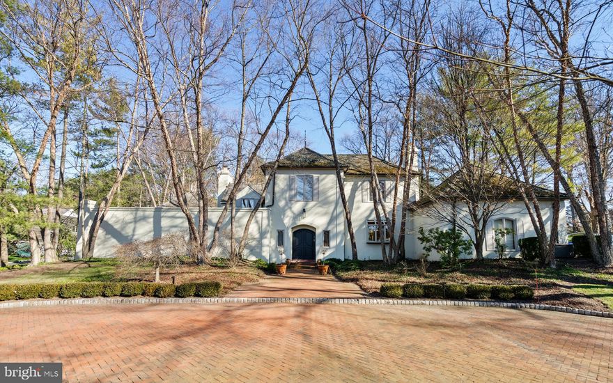 Chic, sophisticated, 3 bedroom 3 1/2 bath French Contemporary home set on a 1.1 acre parcel with Tennis Court on a premium street in Lower Merion township, is available for the first time since the home was custom built and designed by the owners in the mid 1980s.
Distinguished by vaulted ceilings, extraordinary windows and walls of sliding doors that exit to private brick terraces, the natural light in the home and the homes ‘livability’ is unparalleled. Grand entertaining spaces effortlessly accommodate parties on a large scale, while details  such as natural wood beams and a fireside Office/Tv room offer spaces for quieter enjoyment. The First Level Primary Suite is expansive. A large Dressing area, reach-in as well as walk-in Closets, and a sparkling white marble Bath, open to the volume ceiling Bedroom with handsome corner fireplace, plantation shutters and doors that open to your own private patio.Soaring ceilings in the centrally located Great Room feature a two story window to the east and opposite a sweeping staircase that leads to 2 additional Bedrooms, each with private Bath, and a second, discreet Loft/Home office. Dining happens in either the large more formal Dining Room or the adjacent Breakfast Room with both having access to the rear yard and gardens. A timeless, lacquered Siematic Kitchen enjoys views of the front brick turning circle, and mature paperbark birch trees which frame the entrance to the home. 
The Lowest Level is partially finished, offering primary storage and Recreation or Gym and mechanicals. Refined aesthetics married to practical and engaging design.