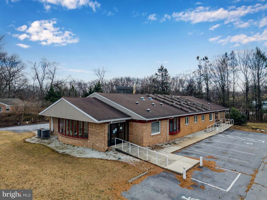All brick office building with nearly 5,000 square feet suitable for various professional or medical uses.   Accessible location off Walnut Bottom Road -- just 0.25 miles from Interstate 81.   The property is situated just minutes from UPMC Carlisle Hospital, near the Alexander Spring Road office corridor, and one mile outside of vibrant Downtown Carlisle.  The building offers three ramped exterior entrances and two parking lots.  The interior features an entrance foyer with plenty of natural light, spacious waiting room,  reception office, conference room, kitchen, three bathrooms, 12 private offices, and office cubicle areas.  Nice interior finishes with LVP flooring and 2x2 ceiling tile grid with recessed lighting.  Sinks in some offices and a lead-lined room for X-rays to accommodate medical uses.  HVAC provided by three electric heat pumps.  Solar panels installed on roof to mitigate electric bill.  Potential to add signage visible to I-81 travelers.