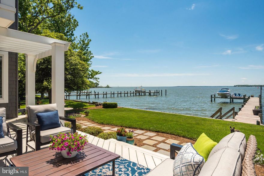 Priced to Sell!!!  Nantucket-Style Elegance in this Purple-Cherry designed waterfront home with a 12' elevation above MLW.  The South River water frontage at the mouth of the Bay are calling boaters to come and enjoy. Main level bedroom or den with water views and full bath.  Open floor plan with generously sized rooms with versatile spaces.  Water views from just about every room in this gorgeous home.  Hard wood floors on every level.  Large master suite with 2 fireplaces and dedicated His and Hers closets.  Bedroom level laundry and home office with Fishing Creek water views.  Third floor offers significant versatility with water views:  rec room, play room, exercise space, guest room, etc.  Large walk-in storage area on third level.  The immediate water views will take your breath away from the moment you enter this lovely, inviting home!