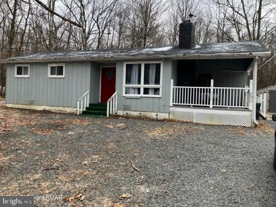 Walk to 2 swimming lakes from this adorable ranch with covered porch, wood-burning fireplace; newly renovated 3 bedrooms and 2 full baths. STR-friendly gated community with lakes, pools, clubhouse, paved roads, security. Septic field is saturated. Seller will give credit.