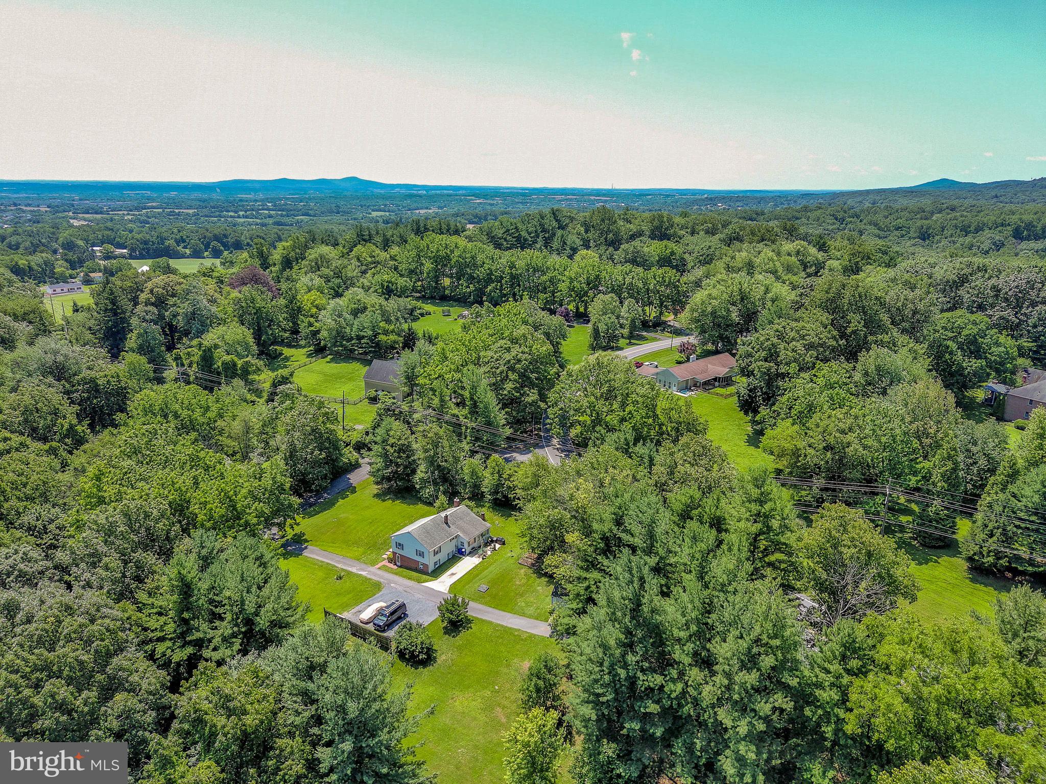 This is 2 parcels -Tax ID 1124466825 also conveys, a .23-acre parcel for a total of a very private 1.44-acre setting- no city tax, no covenants - yet minutes to everything! Beautifully situated with privacy trees this split-level home features an in-law suite with living room/kitchenette, bedroom and bath which has its own entrance from outside yet connects to the inside for a perfect large primary suite if desired. Lower-level basement with outside entrance offers perfect shop/hobby room; This property is perfect for extended family, an air B&B, rental, and a great set-up in the lower level for the hobbyist great space for parking an RV if needed. Well maintained with many updates, with plenty of parking and a detached garage. Enjoy the super convenience of access to major routes to just about everywhere and anything!
