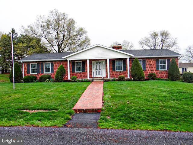 Sentrilock on front rail. Vacant. Schedule online. Convenient one-floor living, two miles from the Borough of Chambersburg. Kitchen has custom oak cabinets, large family room off kitchen in addition to formal dining room all with real hardwood floors. There is a large living room with lots of natural light. Covered porch at the rear of the house to see the panoramic view and watch the evening sun go down. Large, very usable basement with room for workshop for hobbies. Propane gas stove in the family room which can help to heat the house. There is a new air conditioner, radon gas eliminator, and Renewal by Anderson windows. All appliances pass with the sale, plus washer, dryer, and deep freeze. Oversized two-car garage with room for garden equipment. Home sits on a .58 acre lot and is very neat and clean.