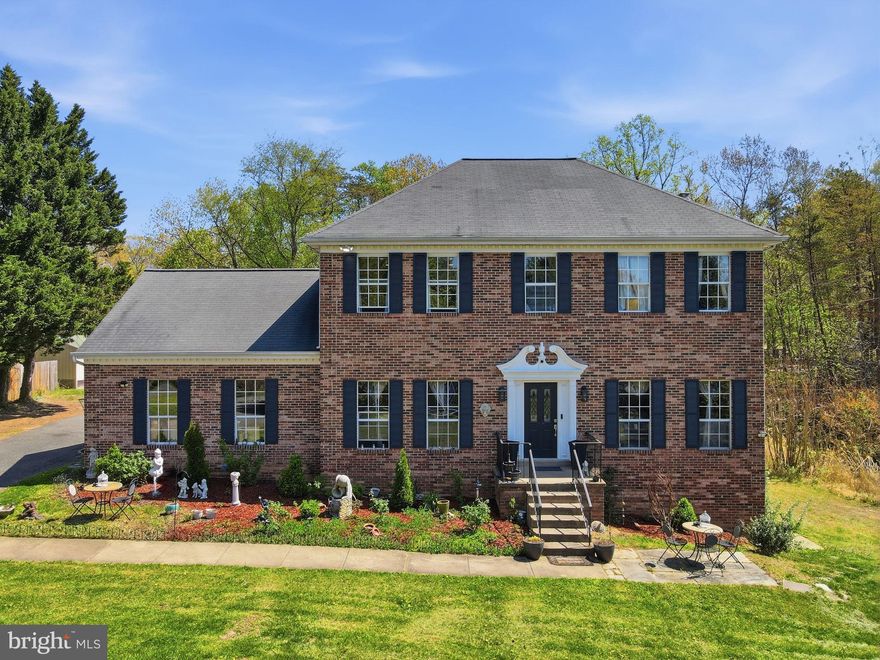 Welcome to your dream home in the desirable Montyville Estates neighborhood! This stunning property sits on a spacious 1.93-acre lot and has beautiful hardwood floors throughout the main level. The main level boasts a grand entry, a large living room, and a formal dining room, perfect for hosting gatherings with friends and family. The spacious family room features a cozy fireplace and glass doors that open to the deck, providing the ideal setting for indoor-outdoor living. The kitchen is a chef's dream, with ample cabinets, a kitchen island, and granite countertops, plus a large window offering backyard views while you cook. Upstairs, you’ll find four spacious bedrooms, including a primary suite with its own ensuite bathroom featuring a shower, soaking tub, and double sinks, along with generous closet space. There is also another full bathroom for the other bedrooms to share. The finished basement is perfect for entertaining or hosting extended family, with a private living area and an additional kitchen and second washer and dryer. Montyville Estates is a highly desirable neighborhood known for spacious lots, quiet streets, and a friendly community. Enjoy a peaceful, secluded lifestyle with easy access to nearby shops, restaurants, and entertainment options. Don’t miss the opportunity to make this stunning property your own!