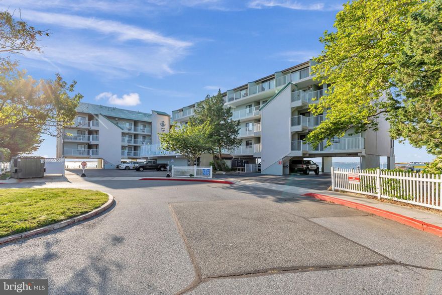 Welcome to this 2 bedroom, 2 bathroom direct bayfront dream with two private balconies! This rare opportunity to own a bayside waterfront gem is one that shouldn't be missed. Upon entering, you will find a thoughtfully designed layout that maximizes comfort and convenience. The first level boasts a well-appointed kitchen featuring granite countertops and a large closet providing additional storage space.  The living room opens up to a stunning balcony, offering breathtaking bay views that will leave you mesmerized. On the first level you will also find a spacious bedroom and a conveniently located bathroom. As you make your way to the upper level, you'll find a spacious bedroom adorned with elegant touches and ample natural light. The bedroom opens up to a second balcony overlooking the pool. The upgrades in the upstairs bathroom add a touch of luxury with its beautiful finishes. This well-maintained property has never been used as a rental. The HVAC system was upgraded in 2017, while the hot water heater was installed in 2023.  The property is also features a convenient Wi-Fi thermostat, allowing you to effortlessly monitor and control it from anywhere you are. Experience a lifestyle of comfort and serenity in this remarkable bayfront condo.