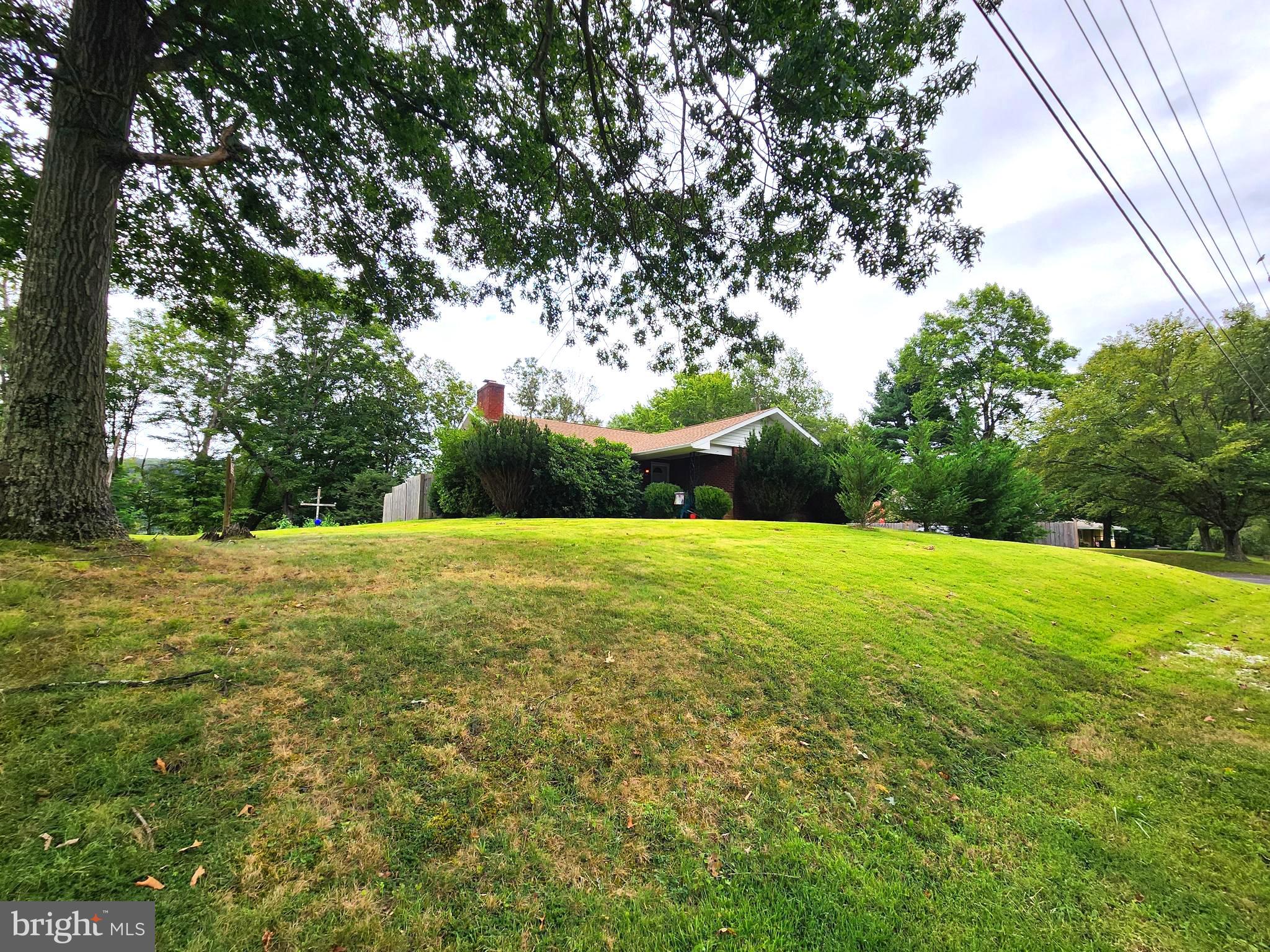 Live Where the Mountains Meet Convenience!
Welcome to this spacious brick, 5-bedroom, 2.5-bath home in the heart of LaVale, where charm, comfort, and breathtaking mountain views come together. With a second kitchen, this home is perfect for extended family, entertaining, or creating your own in-law suite.
Step inside to find beautiful wood floors, newly updated bathroom and flooring, and a layout designed for both everyday living and hosting. Enjoy year-round comfort with central air and a combination of natural gas, electric, and wood heat—plus, the seller is even including a cord of wood and a generator for peace of mind. Spacious screened in rear porch!
Outside, the nice yard and two-car garage provide plenty of space for cars, hobbies, or storage. Everything you see can stay—furniture and furnishings convey if the buyer desires—making this a true move-in-ready opportunity.
Located close to all amenities while still offering the serenity of mountain views, this home is the perfect blend of convenience and relaxation.
Don’t wait—homes like this in LaVale don’t last long. Call today to schedule your private tour! Priced to sell!