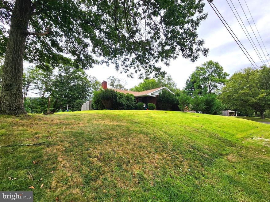 NEW IMPROVED PRICE!!!
Live Where the Mountains Meet Convenience! 

Welcome to this spacious brick, 5-bedroom, 2.5-bath home in the heart of LaVale, where charm, comfort, and breathtaking mountain views come together. With a second kitchen, this home is perfect for extended family, entertaining, or creating your own in-law suite.

Step inside to find beautiful wood floors, newly updated bathroom and flooring, and a layout designed for both everyday living and hosting. Enjoy year-round comfort with central air and a combination of natural gas, electric, and wood heat—plus, the seller is even including a cord of wood and a generator for peace of mind.  Spacious screened in rear porch! 

Outside, the nice yard and two-car garage provide plenty of space for cars, hobbies, or storage. Everything you see can stay—furniture and furnishings convey if the buyer desires—making this a true move-in-ready opportunity.

Located close to all amenities while still offering the serenity of mountain views, this home is the perfect blend of convenience and relaxation.

 Don’t wait—homes like this in LaVale don’t last long. Call today to schedule your private tour!  Priced to sell!