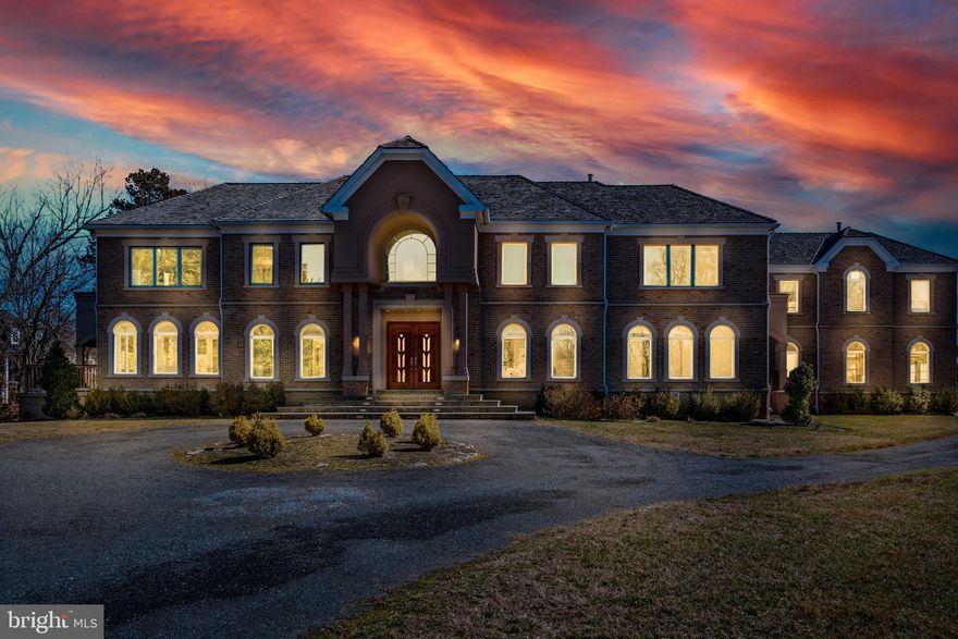 Stunning Luxury Custom Home in Gated Golf-Course Community of Woodmore situated on nearly 3 acres! Breathtaking unique masterpiece luxury home comes crafted with all amenities and appointments that you can imagine. This Palatial Estate home features 6 bedrooms 9 bathrooms with over  11,000 sq ft of living space. Separate In-Law Suite Set-up  with private entrance , complete with a second kitchen, climate control and spacious living area. Grand Foyer Entrance features Greece Rainfall Marble Floors with Imperial Staircase.  First floor features Cathedral Ceilings, Custom Crown Molding, Mahogany Wood Floors, Titon Box Beam Ceiling, Recess Lighting, Rear Spiral Stairs. Kitchen features Quartz Counters, Gourmet Pantry , Farmhouse Sink ,  Recess lighting and Cascading Fireplace offering a delicate striking balance of Living and Entertainment.  Home also boast a Master Suite with Mahogany Wood Floors,  Designer Closet, Wet Bar, Exclusive Laundry equipped with Washer/Dryer, Master Bath comes with his and her custom  tiled shower, signature freestanding tub, LED oversized vanity mirrors. Basement features, Theatre Room, Wine Showcase Room, Wet Bar, Full Kitchen , Family Laundry Station, Master Suite with FullBath and Fireplace, Recess Lights and Tile Floors. Additional features include Geo Thermal System, Elevator,  Circular Driveway, Olympic Pool, Multiple Decks, 3 Car Garage. Woodmore, host to World-class amenities including a golf course + country club with dining, pool, tennis and fitness facilities, don't miss this rare opportunity to own in Most Prestigious Established Community in Prince George's County.