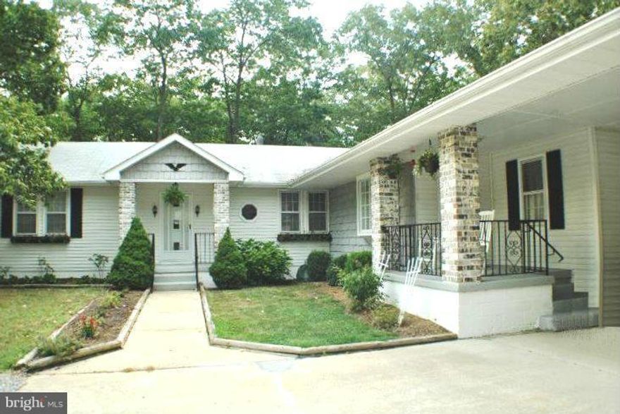 4BR 2FB rambler w/carport nestled on nearly 3 acres backing to wooded privacy.  Huge detached 30' x 35' garage w/heavy electric and upstairs bonus room area. Updated kitchen w/walk-in pantry.  Large master bedroom.  Unfinished partial basement and separate laundry room.  Rear deck. Pets case-by-case.
