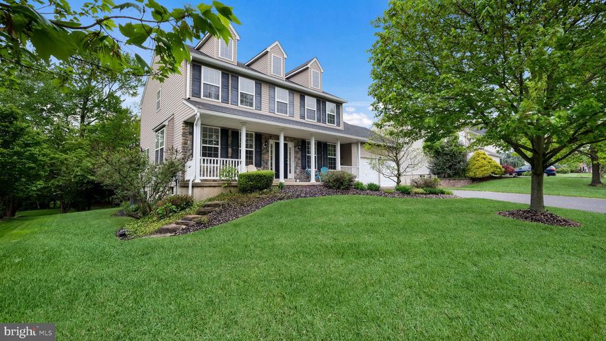 Welcome to this Manor Farmhouse model in Redstone Woods, a Premier C&M Development. The home features a large covered front porch with a Stone facade that opens to a formal center hall entry. 9' ceilings T/O the first floor, Foyer opens to a formal Dining room & beautiful study with custom built-in cabinetry. The Foyer continues into a spacious Eat-in Kitchen with a center island, solid cabinetry, 5 burner gas range, and built-in Bosch dishwasher. Through the breakfast room is a sliding glass door leading to an oversized pressure-treated deck overlooking a manicured lawn and large wooded lot. The Kitchen opens to a spacious Family room. There is a full pantry, and the Powder Rm and Mudroom/laundry room has access to the 2 car garage. New luxury vinyl plank flooring throughout the first floor. The 2nd floor features a Primary Bedroom Suite with a cathedral ceiling, a separate sitting room, large walk-in closet and additional large closet. En suite has a corner soaking tub, separate shower with ceramic tile surround & double vanity. 3 additional roomy bedrooms all with large closets (1 bedroom has double closet) & full hall bath with a tub/shower combination. Wall-to-wall carpet throughout the 2nd floor. Full, unfinished Basement. 2-car attached Garage. Large deep wooded lot situated on approximately 4/10th of an acre, cul-de-sac street, very private setting! New roof in 2021, New 5" Gutters 2024, New hot water heater 2024,New HVAC 2018.