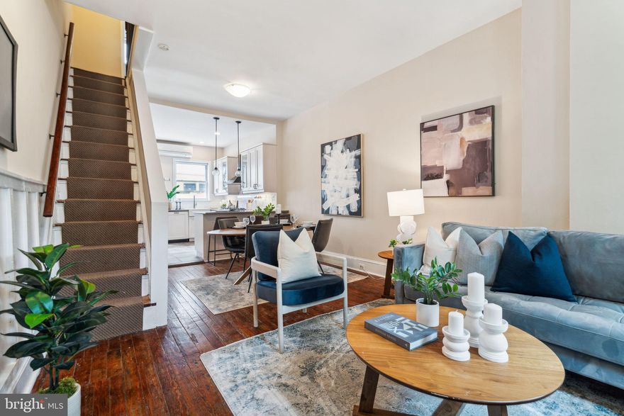 Welcome to this recently renovated 2-bedroom, 1.5-bathroom home in the heart of Graduate Hospital. As you enter, you'll be greeted by a bright and open living space featuring original hardwood floors and a modern updated kitchen. The kitchen boasts ample shaker style cabinetry, a breakfast bar, and newer appliances, flowing seamlessly into the designated dining area. Step out to the private fenced patio, perfect for outdoor relaxation. Upstairs, you'll find two bedrooms with large closets and a modern hallway full bath with a tiled bath shower combo and vanity with storage. The lower level offers a versatile bonus space, ideal for a home office, gym, or playroom, and includes a laundry area and additional unfinished storage space. Conveniently located just steps from Julien Abele Park, Sidecar Cafe and Bar, Ultimo Coffee, Dock Street Brewery, and Los Camaradas and a short walk from Marian Anderson Park, Chew Playground, and the plethora of shopping and dining options in Center City.