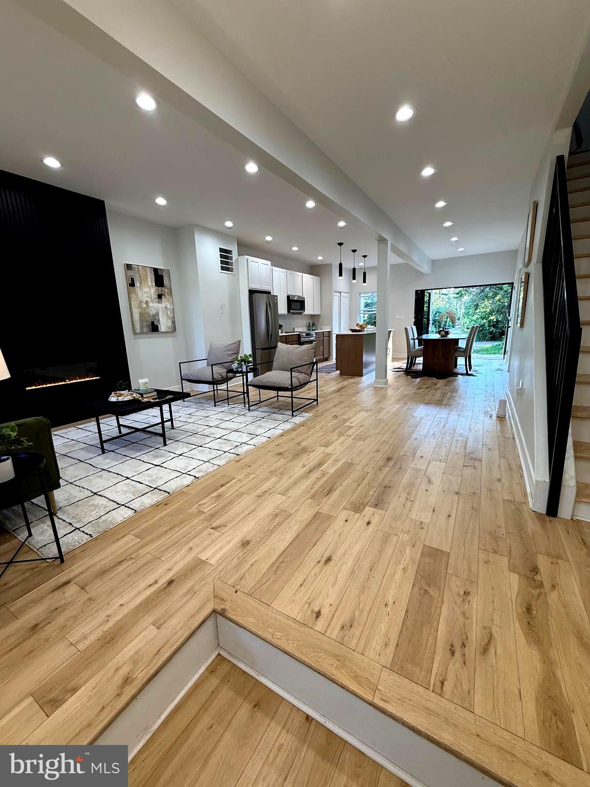 Welcome to 5012 Denmore Avenue, a bold and beautiful renovation located in the heart of the Park Heights Renaissance. This is an opportunity to own a home just steps from the iconic Pimlico Race Course, where the Preakness has been run for generations. This neighborhood is alive with momentum—major redevelopment, reimagined green spaces, and city-backed investment are reshaping Park Heights while honoring its roots. From the redesigned Druid Hill Park to refreshed public pools and community centers, this area is rising—and this home is already ahead of the curve.
Step inside to refined finishes and thoughtful design. 4.5-inch solid oak wood floors run throughout the main level, staircase, and second-floor hallway, providing warmth and continuity. The bedrooms feature soft new carpet, and the fully finished basement includes waterproof luxury vinyl plank flooring to complement the main floor.
The kitchen is appointed with shaker-style oak cabinetry, quartz countertops, and a full suite of Frigidaire Professional appliances. Custom one-panel wood doors, recessed lighting, and a 100-inch accordion door at the rear of the home create a seamless transition to outdoor living and elevate the overall experience. A modern fireplace and carefully curated fixtures add both functionality and comfort throughout.
All major systems—electrical, plumbing, HVAC, and roofing—have been fully updated with professional installation. This home is now ready for showings—and it looks even better in person.
This opportunity won’t last. Schedule your showing today.
Seller is a licensed real estate broker in the state of Maryland.