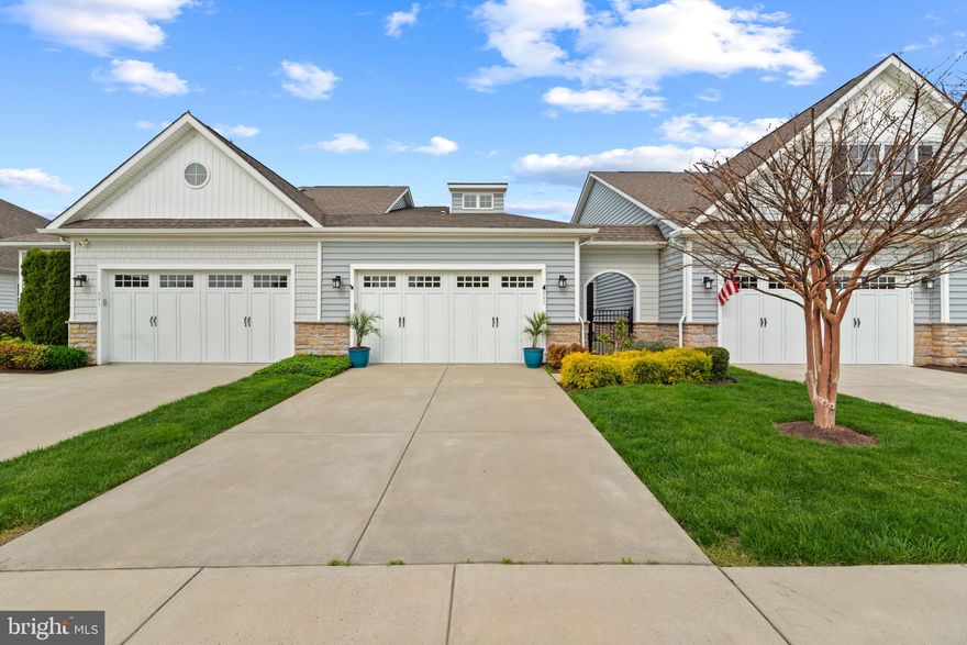 Welcome to easy, elevated living in the sought-after 55+ community of Bay Bridge Cove. From the moment you arrive, the private courtyard entry creates a warm and inviting first impression, offering a peaceful space to begin and end your day. Inside, you’ll find beautiful hardwood flooring throughout and a bright, open layout designed for both comfort and connection. The kitchen is the heart of the home, featuring a spacious center island, granite countertops, stainless steel appliances, and crisp white cabinetry that feels both timeless and fresh. The living area is filled with natural light and anchored by a cozy gas fireplace, creating the perfect space to relax or gather with friends. Just beyond, the sunroom truly shines, offering stunning views of the pond and fountain and a serene setting to enjoy your morning coffee or unwind in the evening. With western exposure, you’ll be treated to gorgeous sunset views that make this home feel extra special. The primary suite offers a peaceful retreat with a tray ceiling, generous closet space, and a comfortable, private feel. A second bedroom and full bath provide flexibility for guests, hobbies, or a home office. Bay Bridge Cove offers a vibrant, low-maintenance lifestyle with amenities including a clubhouse, outdoor pool, fitness center, billiards room, and beautifully maintained common grounds. Lawn care, snow removal, and community management are all taken care of, allowing you to focus on enjoying each day. Ideally located with easy access to shopping, Route 50, and the Bay Bridge, this home offers the perfect blend of convenience and tranquility. Opportunities like this, especially with pond views and sunset exposure, are rare within the community. Come see how effortlessly this beautiful home fits into your next chapter.