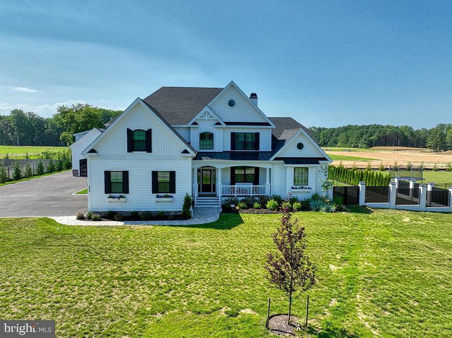 THE PERFECT OPPORTUNITY—whether you’re seeking a dream personal residence, a luxurious vacation home, or a fantastic investment with rental potential, this one-of-a-kind property must be seen to be fully appreciated.

Enjoy luxury living east of Route 1—free from HOA and just 5 minutes from Lewes Beach. The main house was completed in December 2023 and then enhanced with a custom-built detached garage with loft apartment, a heated concrete pool and spa, custom fencing with solar lights, and beautifully designed outdoor living spaces.

Inside, the open-concept floor plan is filled with natural light, soaring ceilings, and sophisticated finishes. The gourmet kitchen features quartz countertops, a massive center island with breakfast bar, Café appliances, and natural gas cooking. Entertain with ease in the bright living room with cozy gas fireplace, work from a private home office, and enjoy two first-floor owner’s suites with walk-in closets and spa-like baths. Upstairs offers a spacious loft plus four additional bedrooms, two with en suite baths.

The finished basement takes entertaining to another level with a family room, game area, bar, home gym, and half bath, along with abundant storage in a conditioned area and walk-in attic. The 3-car attached garage includes an EV charger, sleek black glass garage doors, and a black carbon epoxy floor.

Car enthusiasts will love the custom 8-car detached garage with epoxy floors, black glass doors, ceiling fans, and LED lighting. Above it sits a 790 sq. ft. apartment with living room, kitchen, bedroom, full bath, and mezzanine—ideal for guests, in-laws, or excellent rental potential.

Step outside to your private retreat: a heated pool and spa (each with its own pump and heater), double courtyard with fireplace and built-in grill, custom lighting, screened porch, outdoor shower, and fenced yard with solar accents. A paver-edged driveway extends around the garage for added space and function.

2025 road improvements are currently being completed to provide convenient access to nearby Lewes-Georgetown walking and biking path. 

Premium features include: whole-property security camera system, smart home technology, pre-wiring for solar, electric blinds on rear windows, plantation shutters throughout, and custom drapes in living and dining areas.

Schedule your tour today!