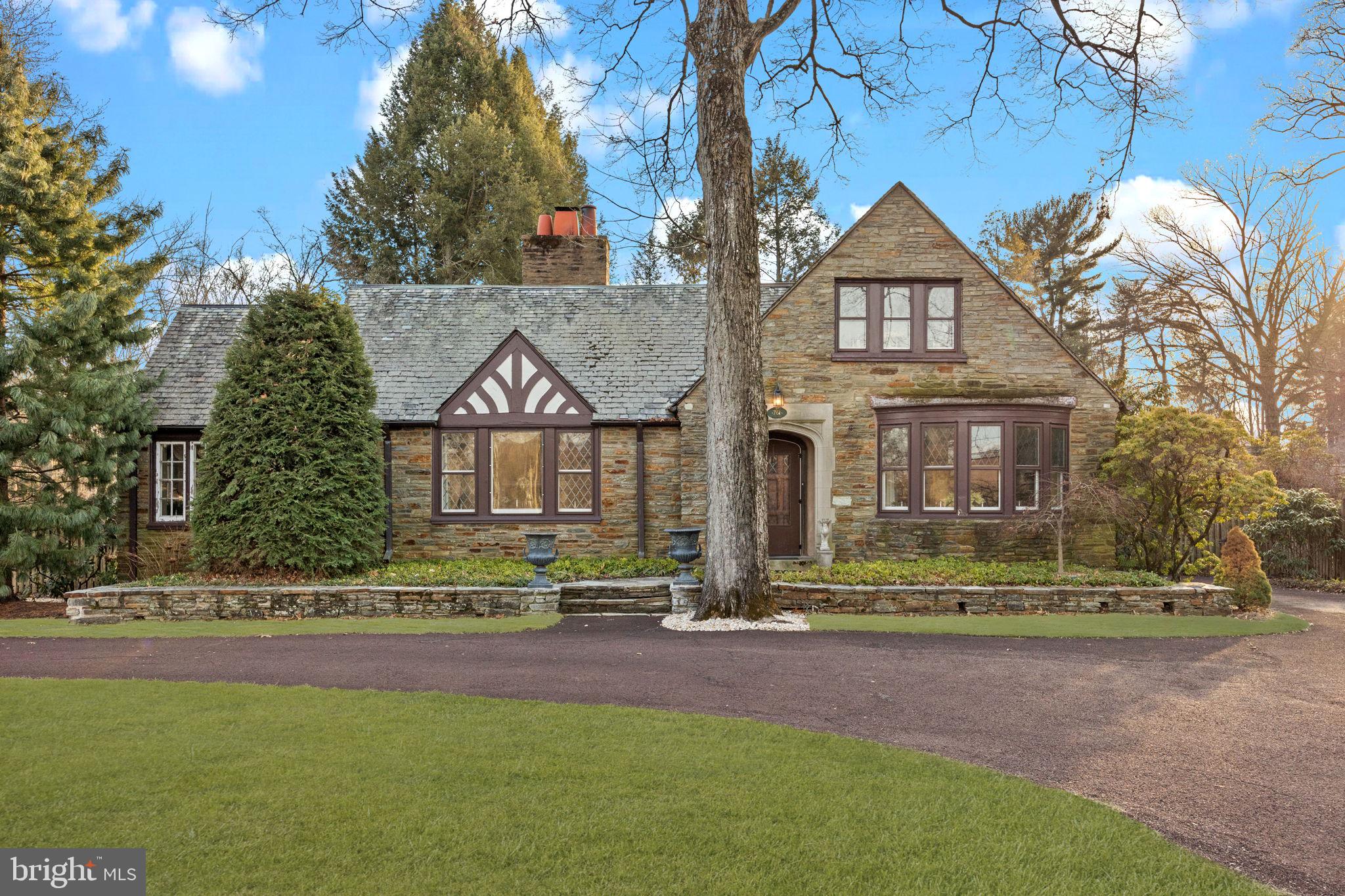 Welcome to 761 River Road in Yardley, Pennsylvania! Located in the heart of Historic Bucks County and along the bucolic Delaware River, this majestic property is set on just over .8 acres of land that includes two parcels in total (20-046-138 size: 100x304 & 20-046-195 size: 100x45). Parcel #2 offers Riparian Rights and access to the beautiful Delaware River. This Tudor style home is full of charm inside and outside. The governors driveway circles in front of the main entrance where a natural stone walkway leads to the front door. One of many unique features of this home, built in 1931, is that is is constructed of natural fieldstone (on all four sides) that was quarried locally. Inside the front entrance is the large greeting area with the formal dining room on the right and flanked to the left, is the exquisite living room. Original hardwood oak flooring carries through from the foyer area, and into both the dining and living rooms. Another point of interest in this home are the many beautiful windows (some with leaded glass) that bring in so much natural light! In addition, the original living room fireplace tiles are from the famed Mueller Mosaic Tile Company in Trenton, NJ, and the owner of Mueller Mosaic Tile was a friend of Henry Chapman Mercer, the founder of the Moravian Pottery Tileworks Company located in Doylestown, PA. Much of the original tile from the earlier 1930's is evident throughout the house especially the bathrooms and magnificent living room fireplace. Continuing on through the living room area is the light drenched sunroom where many hours are spent relaxing! Back out to the foyer are and directly through the center hall is the kitchen. Updated in 1996, the kitchen is designed to be space efficient. Surprisingly, there is an over abundance of cabinet space and the flow throughout the kitchen allows for a small table in the center. Cabinetry is high quality with inset doors and upper cabinets that reach the ceiling. The main bedroom is located on the first floor and has the primary bathroom attached. There is an additional full bathroom on the main level along with a bonus room that can be a bedroom (especially with the full bathroom beside it) or as a den area which is the current use. Upstairs there are two additional bedrooms and another full bathroom. The bedroom facing front towards the river, has breathtaking views! It could be considered the "best room the house". A huge walk-in closet is adjacent to the front bedroom and is great for extra storage. There is a full basement below that has another egress to the outside. Speaking of outside, the grounds around the are beautifully maintained. There is a gigantic stone patio in the rear of the home, overlooking the majestic backyard. In addition, the extended driveway circles into the back of the house where there is a two car garage. Conveniently located just a short distance from downtown Yardley and has access to two bridges to New Jersey. Easy commutes and close to everything! Homes are not built like this any longer so take advantage of this priceless gem!