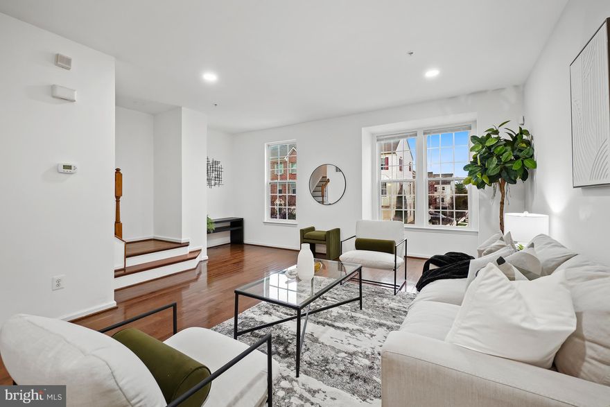 Sun-filled townhome designed for easy living and a commuter-friendly lifestyle! This spacious 3-bedroom, 2.5-bath home features an open-concept layout with gleaming hardwood floors throughout the main level—perfect for everyday living and entertaining.
<br>
<br>
The stylish kitchen offers stainless steel appliances, granite countertops, 42” cabinetry, and a center island with breakfast bar, flowing seamlessly into the living and dining areas with direct access to a private deck backing to common area open space. 
<br>
<br>
The primary suite provides a relaxing retreat with large walk-in closet, including a primary bath with tub and, dual vanity.  Large recreation room with walk-out level to patio and fenced yard.
<br>
<br>
Unbeatable location for commuters—quick access to major routes including I-95, BWI Airport, Rt -1, MARC train, and nearby transit options. Convenient to Ft. Meade, NASA, Washington, DC, and Baltimore. Enjoy low-maintenance living close to shopping, dining, and entertainment.
<br>
<br>
Contact the listing agent with any questions or to schedule your private tour.