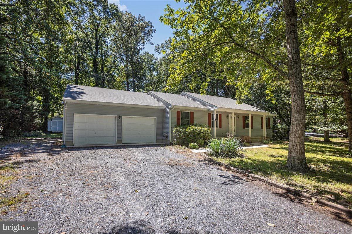 Welcome to Passapae Landing community, where peace, privacy, and comfort come together!
This beautiful maintained 3-bedroom, 2-full bathroom ranch style home offers 1,344 sq ft of easy, single level living on nearly 1/2-acre lot-and its ready for you to move right in!
Step inside to a bright, inviting layout perfect for both everyday living and entertaining. the spacious living area flows into a well-appointed kitchen and dining space with beautiful upgraded granite countertops, making family dinners and get-together a breeze. The new HVAC was installed less than a year ago! The motor well pump was installed a year ago.
Outside, relax on your screened in rear deck overlooking the private backyard. Not one, but TWO storage sheds give you all the space you need for tools, hobbies, or outdoor gear, while the two-car garage keeps vehicle's safe and secure. No HOA, and no town water/sewer bill! Security system installed and ready to be activated. Central vacuum installed in multiple rooms, making cleanups super convenient. Whether you're looking for a peaceful starter home or a downsizing retreat, this home delivers comfort, convenience , and the countryside charm! Schedule your showing today!