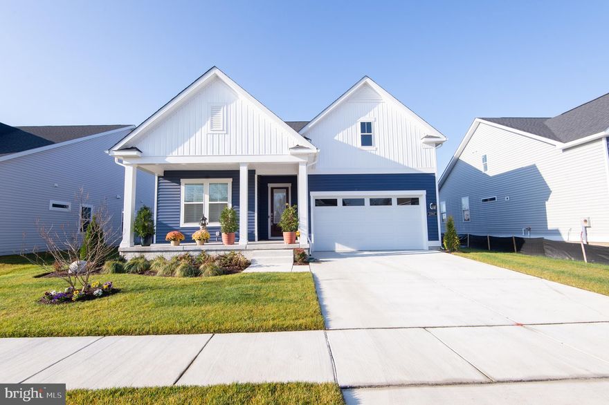 Welcome to The Tides at River Marsh, where coastal Eastern Shore living meets resort-style amenities. This brand-new 3 BR, 2 BA Latitude model by DRB Homes is perfectly positioned along the 16th fairway of the River Marsh Golf Course, part of the Hyatt Regency Chesapeake Bay Resort community with optional access to the golf course, spa, and marina.

Designed with an open, airy layout, the home features a great room concept with vaulted ceiling, gas fireplace, and seamless flow into the gourmet kitchen. The kitchen offers white cabinetry with gold hardware, glass-front accents, quartz countertops, farm sink, stainless steel appliances, gas cooktop, wall oven, center island with breakfast bar, and a separate dining area. Abundant cabinetry with under-cabinet lighting and a walk-in pantry provide exceptional storage. The great room opens to a screened rear porch overlooking landscaped grounds and lawn irrigation.

The spacious primary suite includes a tray ceiling, walk-in closet, and a luxurious bath with free-standing soaking tub, ceramic tile walk-in shower, and dual-sink vanity. Two additional bedrooms share a beautifully finished ceramic tile hall bath. A welcoming foyer, recessed lighting throughout, pre-wiring for ceiling fans, and custom Hunter Douglas plantation shutters enhance the home’s style and comfort. A 2-car garage with automatic opener adds convenience and storage.

The Tides at River Marsh will feature pickleball courts and a community pool, with optional marina and golf memberships offering boat dockage on the Choptank River and access to the acclaimed River Marsh Golf Course.

More than a home—this is a lifestyle.