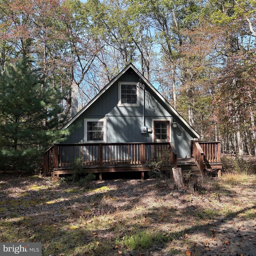 Escape to your private getaway in the mountains of West Virginia! This charming A-frame cabin is nestled on 5 mostly level acres with beautiful rock outcroppings, offering the perfect blend of seclusion and adventure.

Located in the desirable Ritter’s Hidden Valley community, this property gives you access to two lakes—one for fishing and one for swimming—plus over 20 miles of roads and trails open to ATVs. Whether you're into , hiking, fishing, hunting, or simply soaking in the mountain air, this is the ultimate outdoor playground.
The cabin features the classic A-frame design with an open living area, cozy finishes, and large windows that bring the outdoors in. It’s a perfect spot for weekend getaways or even as a short-term rental investment.
The lot is mostly flat and usable.  There's no HOA, but the roads, lakes, and community spaces are well-maintained by the RHV Maintenance Corporation for a low annual fee of just $300.
Additional community amenities include a park, picnic areas, and tennis courts—so there's truly something for everyone.
Don’t miss your chance to own a slice of West Virginia heaven. This is the mountain retreat you’ve been dreaming of.
