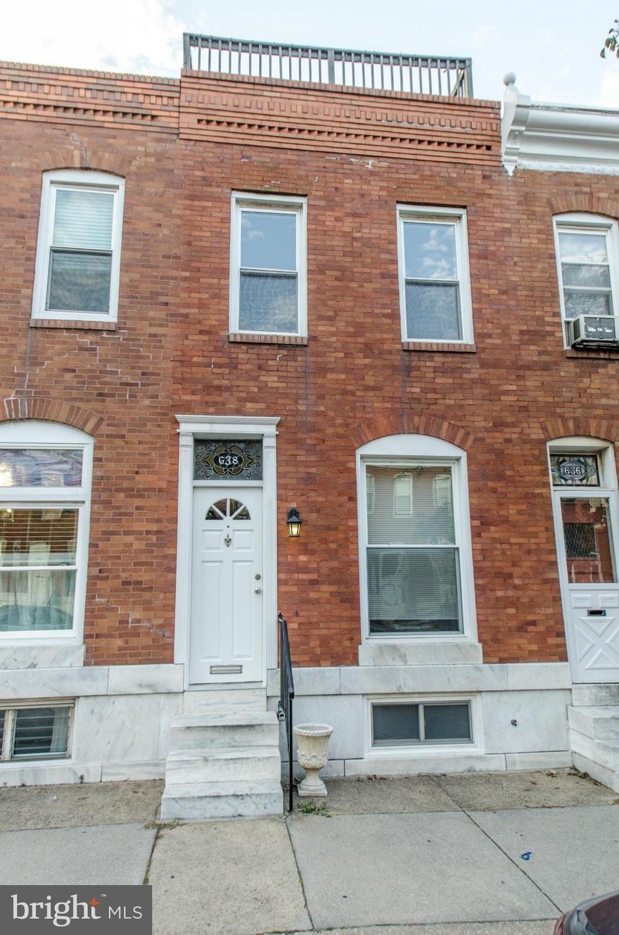 In move-in condition, this true 4 bedroom, 2 full bath Canton townhome offers a spacious Living/Dining combo with glowing wood floors, large eat-in Kitchen w/ stainless applcs, laundry room, great rear deck & fenced-in back patio.  Location in the heart of Canton is convenient to everything - shopping, entertainment, services & the waterfront! Enjoy the awesome Roof Top Deck!!