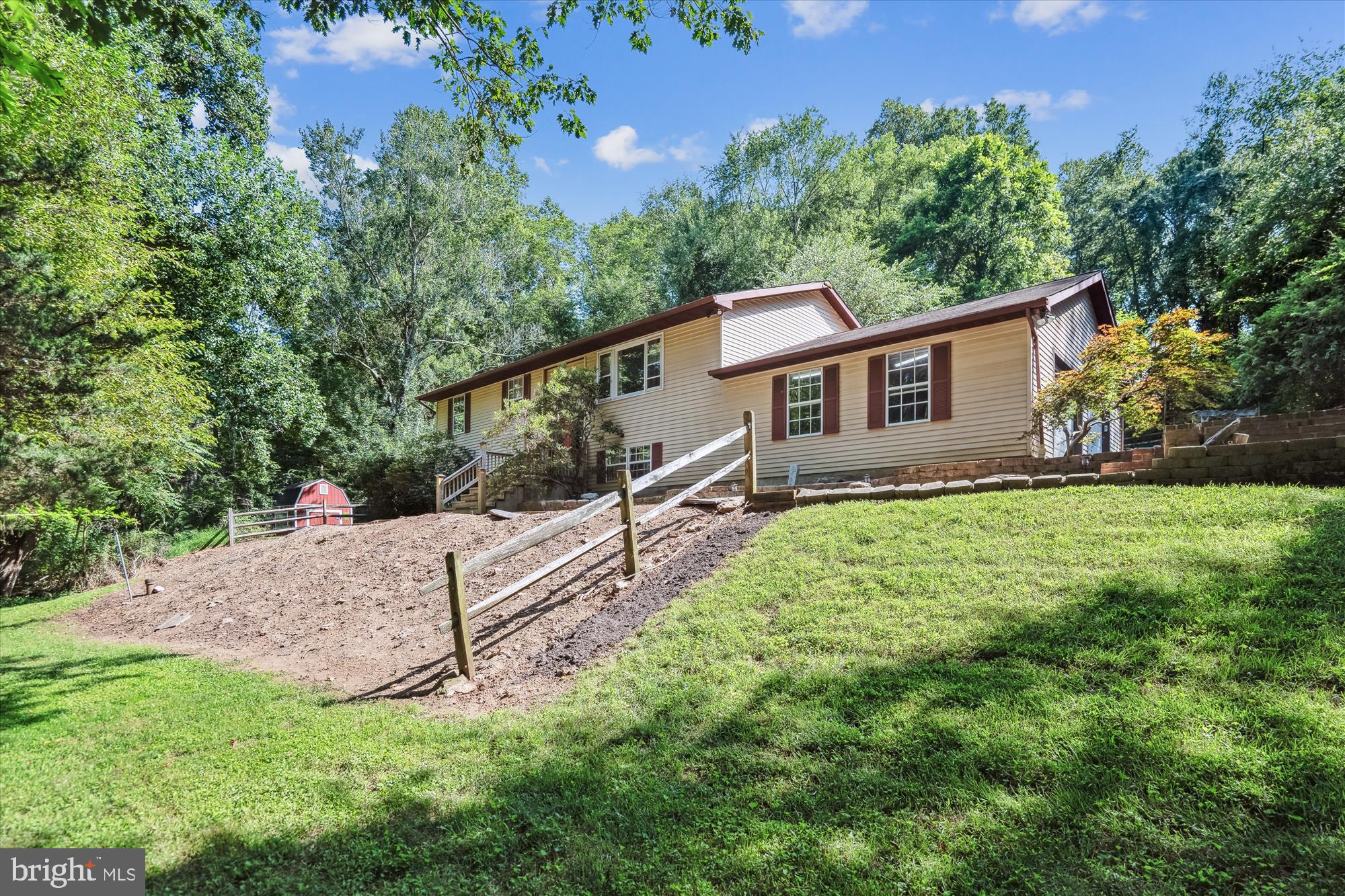 Welcome to 2126 Carrollton Rd. Country Living with over 1.6 acres of land this 4 bedroom 2.5 bath home offers privacy and space while also being minutes to Westminster. The main level has hardwood floors and high ceilings. The large windows let in tons of natural light. The family rooms flows into the dining room and kitchen. The kitchen has granite countertops and stainless steel appliances. Off the dining room is access to the covered deck and fenced in backyard. The primary bedroom fits a king size bed and has an ensuite. Two additional bedrooms and a full bathroom complete the top floor. All 3 bedrooms have brand new carpeting. The downstairs is finished with plenty of recreational space and access to the backyard. There is also an additional bedroom and half bathroom. There is a 2 car garage and driveaway has plenty of room for parking. Schedule your showing today!