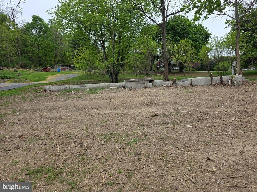 Corner lot on quiet South Mountain Road just south of Dillsburg and less than 3 miles from US 15.  This lot is very unique.  Near the roadside there is a block foundation (24'x48') with water, sewer and electric.  There was a double-wide on the foundation, but it was demolished and removed.  This is your perfect opportunity to place a new mobile, modular, or construct a new home on the site.

This 1.10 AC lot has trees and a shed but needs some landscape work.  With some vision, this could be a very nice homesite.  Taxes reflect property with a double-wide home on site and have not been adjusted since it was removed a few months ago.