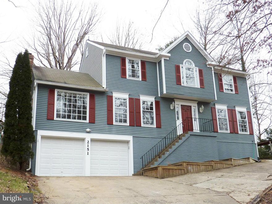 Large colonial with 2 car garage, 4 spacious bedrooms on upper level.  New carpet, paint.  Hardwood floors.