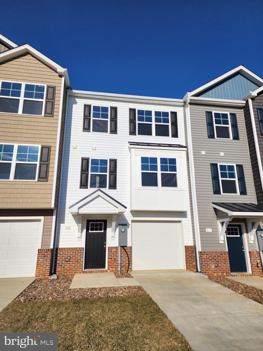 This interior-unit 4 bedroom, 3.5 bath garage townhome has an open concept design on the main floor w/ a kitchen island with granite top, 42" cabinets, a high low peninsula with granite top for entertaining, stainless-steel appliances, a large living room w/ a bump out and a half bath. The upper level features a large primary bedroom w/ cathedral ceiling, walk-in closet, double vanity and a walk-in tile shower; two guest bedrooms, full guest bathroom, linen closet and laundry. The lower levels feature a coat closet, foyer, single car garage w/ automatic garage door opener (app enabled also) and fourth bedroom with a full bath w/ door to access to your backyard, this room makes a great recreation room as well. There will be NO homes built behind you here!!! Throughout the home you will find recessed LED's, ceiling fans in the Primary bedroom & living room w/ each additional bedroom pre-wired for ceiling fans. High/Low outlets w/ pass through plates w/ CAT5/COAX/HDMI in Owner's bedroom & living room to make mounting your TV a breeze. You get more for your money with Four Points Construction. We are a featured loaded builder. Winner of WV Best in Class for Energy Efficiency - The Communities of Burwell has done it again! Pictures are of similar construction townhome.