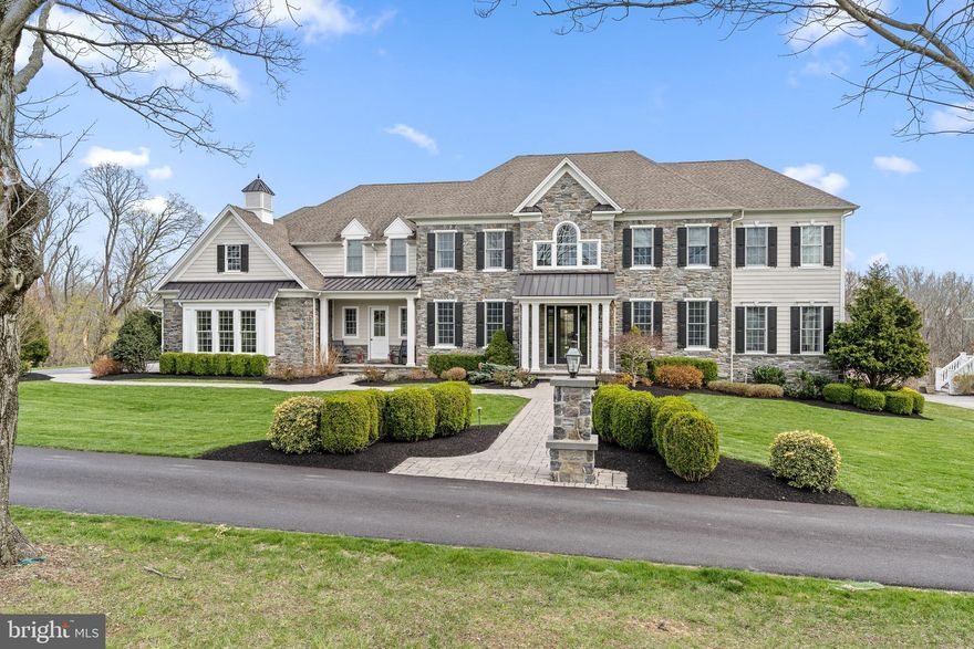 The absolutely gorgeous, award-winning Weatherstone Manor model home in the most sought-after new-home community in Newtown Square right near Episcopal Academy, and close to Whole Foods, restaurants and the new shops! The Weatherstone at Liseter has an immediately captivating presence, as well as one of the largest lots in the community combined with connected open space, makes the yard feel really large and extremely private. Located in a spectacular estate setting, the home features full smart home automation of sound system and lighting. A dramatic stone and siding combination, elegant front portico, standing seam roof accents in the front gables, stone pillars topped with gas lanterns, 5 car garage and a world-class landscaping package. This 6 bedroom home was the Model home in the estate section, so it has every imaginable upgrade you could want, every bedroom has walk in custom closets, and stunning moldings. Its casual elegance is reflected through hand-scraped wide-plank wood floors throughout the first floor, 2nd floor hall and Master Suite. The wainscoted front and rear foyers, a traditional Main-Line feature, add character to this home's natural charm. Traditional center hall expands front to back with large formal living room and dining room with conservatory addition. The impeccably appointed gourmet kitchen of this stately home boasts abundant counter space, a large island with seating for 5 plus 2 dishwashers, a beverage center, beautifully upgraded cabinets to the ceiling, a 60" Wolf Range, warming drawer, built-in Sub-Zero fridge, built-in microwave and access to the back staircase; and it is adjacent to the morning room, which features a cathedral ceiling and plenty of natural light and a Planning Center. The Butler's Pantry off the kitchen features a massive wine fridge and built-in wine rack. The expansive family room includes a twelve-foot ceiling, 2-sided stone fireplace with built-ins and large sliding glass doors leading to the outdoor deck. Adjacent to the Family room is the very well designed and well appointed study with a fireplace, built-ins and a door to the outdoor deck. The primary bedroom is a true retreat featuring a sitting area with a gas fireplace, a lavish primary bath with a free-standing tub, tray ceiling, 2 vanities, a large shower, a private toilet area, and 2 spacious walk-in closets with valet tables and custom closet organizers. A convenient second-floor laundry, plus the three secondary bedrooms, each with their own bath, complete the second floor. The rear of the home has a large custom designed wood deck with steps to grade, complete with an elegantly designed covered cabana with vaulted beadboard ceiling. The steps lead to large hardscape patio with built-in exterior grill, kitchenette with granite tops, and a stone fireplace to provide the perfect space to entertain - all accessible from the finished basement w/ full bath. Great views of the pond off of the deck. The community amenities will make you feel like you live in a country club. Private community pool, gym, sports courts, and walking trails along with a community barn that is simply stunning for entertaining. 

This location is the ultimate in convenience to Center City Philadelphia, Amtrak to NY from Paoli, quick to NJ beaches. Experience the best of town and country living in this true gem!