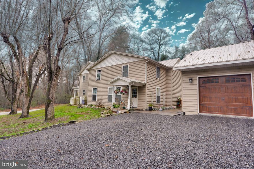 Rural colonial character with serious practical value — 3065 Buchanan Valley Road is a 4-bedroom, 3 full-bath, 2,516 sq ft colonial set on 1.92 private acres in rural Adams Co, PA, just 15 minutes from Gettysburg in the Gettysburg Area School District.
Built in 1930 and substantially renovated in 2005, the home features a mix of luxury plank and hardwood flooring throughout, a main-level bedroom and full bath, and a concrete patio and porch on two sides that sets the tone for the rural lifestyle this property delivers. The kitchen offers adequate cabinet space and tile countertops. 
What makes this property stand apart from comparable rural inventory is the outbuildings. The brand new detached 30x32 garage has two doors with openers, a concrete floor, and a 12x32 storage loft above — a serious workspace for tradespeople, hobbyists, or anyone who needs more than a standard two-car garage. A separate 16x24 barn built in 2019 adds modern outbuilding capacity without the deferred maintenance of older structures. Both buildings sit on the usable, level portion of the 1.92-acre lot. And No HOA. No restrictions. Franklin Township, Adams County.
The Gettysburg Area School District ranks in the top 30% of Pennsylvania public school districts, with a student-teacher ratio of 13:1 and above-average math and reading proficiency scores. Orrtanna sits at the eastern foot of South Mountain, surrounded by apple orchards, wineries, and preserved rural landscape — roughly 55 minutes to Frederick MD, 60 minutes to Harrisburg, and 45 minutes to York.
This is a property for the buyer who has been looking for rural acreage with real outbuilding infrastructure and the freedom to use their land — without the price premium of larger parcels or the restrictions of planned communities. Schedule a Personal Showing Today!