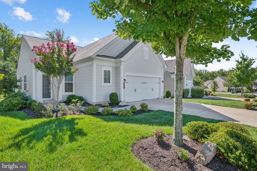 Professional Photo's Coming Wed.    Popular Passport Model ready for immediate move in.  Pride of ownership is evident inside and out. Custom landscaping enhances the exterior. Be dazzled by the gathering room with linear fireplace and plantation shutters as well as the gourmet kitchen with commercial range, loads of storage, oversized island and quartz countertops. The sun drenched kitchen further rewards with breathtaking nature views. Just off the kitchen the inviting sunroom affords great views as a quiet, peaceful retreat for morning coffee or an evening glass of wine. The openness of this home makes it perfect to relax with a movie or friends. This one has it all. After partaking of any of the community’s numerous social and fitness options at the Celebrate lodge end your day in the generous-sized, newly carpeted master bedroom and bath with frameless shower. The guest room, also newly carpeted, is separated from the primary with the second bath. The den at the entrance has a closet and can be used as third bedroom. A couple of things you might initially miss are remote shades on the kitchen windows and extra air conditioned attic storage with unique metal pull down stairs (awesome). Hurry as this will not last long. Value, Condition and View make it a 10+