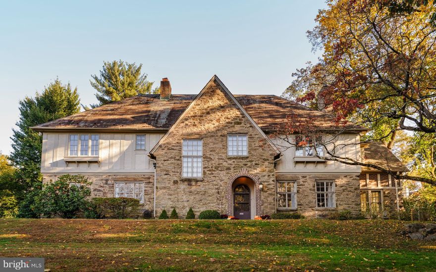 Nestled in the heart of Jenkintown Manor, 247 Meetinghouse Road is a stately English Tudor that blends classic architectural charm with thoughtful, high-quality updates throughout. This 5-bedroom, 3 full/2 half bath residence offers over 4,300 square feet of beautifully maintained living space, including a sunlit living room with wood-burning fireplace, an exquisite marble-floored sunroom with custom built-ins, and a formal dining room with fireplace and French doors that open to the private rear patio and pool.

Anchored by a classic stone façade and steeply pitched rooflines, the home’s exterior was freshly painted in 2024 and enhanced with updated landscaping and new hardscaping. Mature trees surround the property, creating a private, picturesque setting. At the heart of the backyard is a refinished in-ground pool with a new heater and safety fence.

The kitchen has been tastefully refreshed with radiant heat floors, updated cabinetry, new stainless appliances and connects to a cozy wine room with its own gas fireplace. Upstairs, you'll find five spacious bedrooms, including a primary suite with remodeled ensuite bath. A fifth bedroom features an ensuite bath and walk-in closet, ideal for guests or a home office. Laundry has been conveniently added to the second floor with new appliances.

Modern touches continue throughout: knob and tube wiring has been fully removed and a new HVAC and heating system installed. Every room benefits from fresh paint, wood floor repairs, and careful craftsmanship including updated spindles on the staircase baluster. Even the basement has been reimagined, with a repaired staircase, new drywall, and pipe upgrades.

Located in the award-winning Abington School District and just moments from the Abington Art Center, scenic trails, tennis courts, and the charming shops and cafés of downtown Jenkintown, this is a home that not only honors its architectural roots but embraces a modern lifestyle. Just minutes away from the Jenkintown train station, the location provides easy access to Center City Philadelphia and Manhattan.

247 Meetinghouse Road is more than a house; it’s a thoughtfully curated residence, lovingly updated and ready to be the setting for your next chapter. Welcome home.