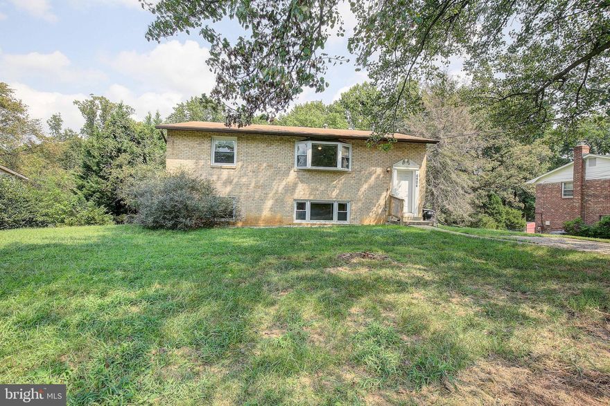 This beauty is ready for you! This lovely well cared for split foyer is not your typical floor plan and offers you so much space and a HUGE yard and deck! Come and take a look and you will fall in love with the 2 family rooms, updated bathrooms and kitchen. Enjoy the lower level as an entertainment area, kid play room, or a recreation room, bedrooms and full bathroom.  The unfinished area is perfect for storage, never have enough of storage.  The upper level offers 2 bedrooms, 1 bathroom a large family room and dining area along with a nice size kitchen that leads to the HUGE deck for all of the summer, spring and fall gatherings.  Private back yard backing to the woods and a great location for easy access to Rt 5 so you can get to NOVA, DC or Annapolis without a hassle.  Come check out this great home!