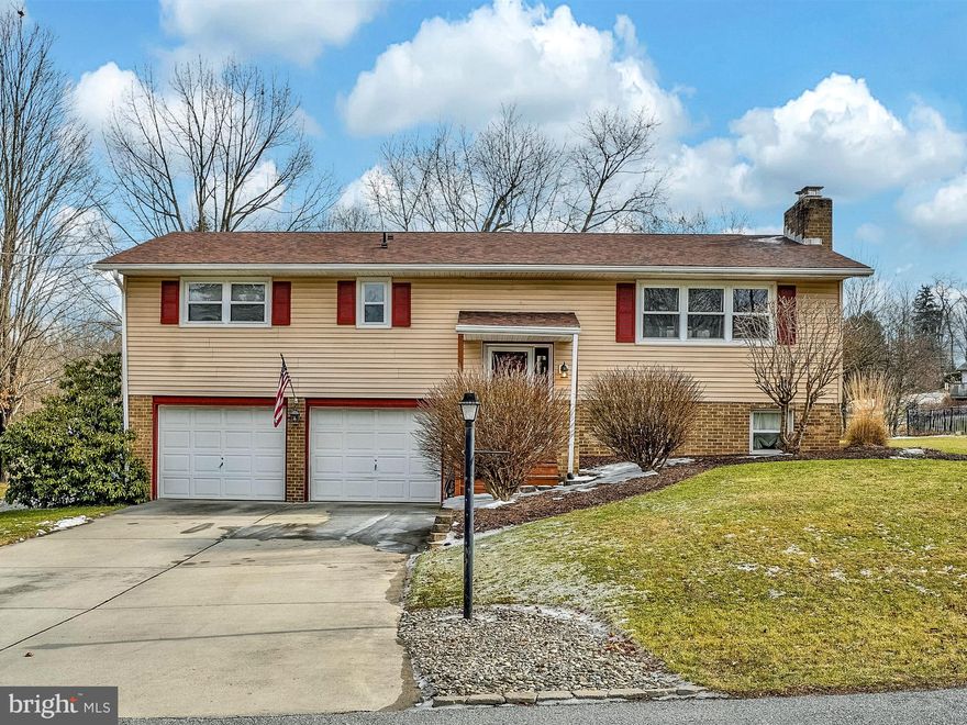 Beautiful 3 bedroom 2 bath Bi-level home just minutes from Rt 15 and shopping.  Move in ready with excellent updates!  Living room with wood burning fireplace opens to dining area.  Kitchen leads to a large deck big enough for grilling and entertaining.  Hall bath updated 2019.  Wood/coal stove in the finished lower level.  Nice touches throughout, including hardwood, wainscoting and ceiling fans.  Huge yard, fully fenced with a pavillion and fire pit.