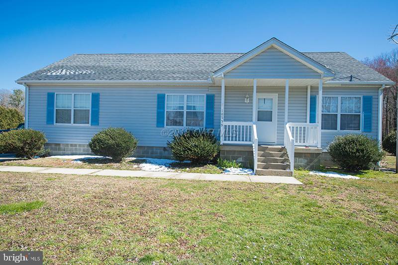 Spacious rancher nestled on almost 9 acres of land Front porch, paved drive way, and great location! Many possibilities with this one!