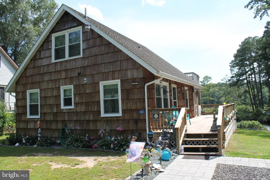 Motivated seller price reduced 10,000! Welcome to this beautifully upgraded 3 bedroom 1 1/2 bath waterfront home that perfectly blends comfort , character, and costal living. Nestled along the serene banks of the Little Wicomico River, with 4ft mlw,  this property offers everything you need for year around enjoyment or the perfect weekend getaway.
Step into the upgraded kitchen, featuring sleek granite countertops,  new stainless steel appliances, and ample cabinet space- ideal for cooking and meal prepping . The generous -sized living room invites relaxation with its cozy wood stove, perfect for chilly evenings . Upstairs,  the second bedroom  balcony provides stunning panoramic views of the water- a peaceful spot for morning coffee or evening sunsets. 
Outdoor enthusiasts will appreciate the private boat ramp, dock with boat lift, and an additional lot complete with its own dock- perfect for hosting guests or build a guest house or another home. A charming "she Shed" offers a peaceful escape or creative studio, complemented by an additional storage shed for all of your toys  and tools. 
This is more than just a home- its a lifestyle. Don' miss your opportunity to own your slice of waterfront paradise! Sellers have found home of choice and are ready for a offer.