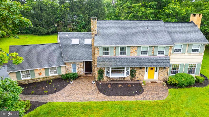 SHOWINGS BEGIN AT OPEN HOUSE Welcome home to this Classic Stone Colonial in the heart of Gwynedd Valley on beautiful, prestigious Gypsy Hill Rd where each home is unique. Nestled on over an acre of beautifully landscaped grounds, this elegant 4 bedroom, 3.5 bath home offers timeless charm and modern amenities with a beautiful In-ground Pool, Large Bluestone Patio, and a Covered Back Porch.  From the moment you enter, the home exudes warmth and sophistication featuring Wide Plank Hardwood Floors, beautiful Millwork, and Wainscoting that grace the Foyer and continues up the Staircase into the 2nd floor hallway, adding a touch of elegance throughout. The spacious Sunken LR features French Doors and serves as a welcoming gathering place highlighted by a cozy Marble Fireplace that sets the tone for relaxed evenings. Adjacent to the LR, the Formal Dining Rm is bathed in Natural Sunlight thanks to the Bay Window that offers up picturesque views of the Pool area, creating an inviting atmosphere for meals and entertaining. At the heart of the home lies the updated Kitchen with Stainless Steel Appliances, Granite Counters, a Center Island with a 2nd Oven and sink, and a wall of Pantry Space off to the side. There is a  Back Door that has a charming half door feature that leads to the Covered Porch, Patio, Yard and Pool area. The Kitchen also seamlessly flows into a charming Sitting Area with a Large Bay Window and it's own Wood Burning Fireplace. This space is perfect for casual dining or enjoying a quiet moment. The 2 Story Great Room is off the Kitchen and is a standout with it's wall of Glass Doors overlooking and providing access to the beautiful Patio and huge Backyard. The room's warm wood ceiling and fan enhance it's ambiance making it an ideal spot for both relaxation and entertainment.  Looking up you see separate Loft off the 4th Bedroom which overlooks the Great Room, offering a versatile space that can serve as an office, study, or reading nook. There is also a Full Bath and Laundry Rm conveniently located on the 1st floor off of the Great Rm near the Garage. The Home's 2 Front Entrances offer convenience and flow for the homeowner. One leads into the Foyer where there is a Newer Half Bath, providing  access to the Living Room or Kitchen, while the other opens directly into the Great Room enhancing the home's functionality. Upstairs you'll find the charming and spacious Primary Suite with Built in Cabinetry that extends into the fabulous fully fitted  Double Walk in Closet with Windows overlooking the Back. The En-suite Bathroom includes a double vanity and a Large shower. Three more spacious Bedrooms round out the 2nd floor and a Full Bathroom in the Hall. There is access to a pull down Attic in the 3rd Bedroom giving additional storage space. And the 4th Bedroom leads to that awesome Loft area with 2 skylights bringing in more natural light. 
The Finished Basements adds even more living space that can be tailored to your needs, whether it's a gym, home theater, or playroom. Lots of closet space in the basement as well.  Out back, step outside to your own private oasis. The expansive Backyard is highlighted by the In-Ground Saltwater Pool surrounded by fencing and beautiful landscaping that offer both privacy and safety. Adjacent to the pool, the open level yard is surrounded by mature trees and is perfect for outdoor activities such as volleyball or other sporting games, making it perfect for gatherings and picnics.  The large Blue Stone Patio is great for grilling in the summer, and you can spend time out of the sun on the Covered Patio. This home has 3 Zone HVAC, a New Boiler 2021, a Brand New Polaris Robotic Pool Cleaner (2025) and a newer pool pump (2023)
Close to the Penllyn Train Station and plenty of shopping (Whole Foods), this home combines classic colonial architecture and thoughtful design offering a perfect blend of comfort, style, and functionality. It's a place where cherished memories are waiting to be made.