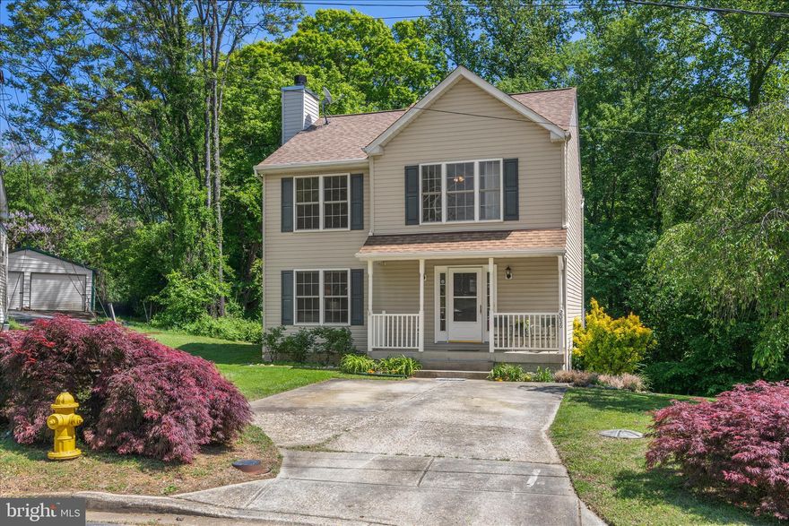 Welcome to your Private Oasis located right in the heart of everything Annapolis!!  LOCATION!!***LOCATION!!***LOCATION!!*** Just off of Bestgate Road, Gate Drive is a sleepy little Cul-de-Sac of private stand-alone homes.  2056 Gate Drive sits at the end of the street, backing to beautiful, lush private woods.  But just up the street is the convenience of Bestgate Road with it's immediate access to the Anne Arundel Medical Center,  and Rt. 50.  Another 5 minutes to Rowe Blvd,  West Annapolis, Shopping, Navy Stadium and Historic Downtown.  Turn left on Bestgate and you are at the Mall , and then to Parole Town Center.  This location for a STAND-ALONE HOME is unmatched!!  The house itself is in mint condition:  Gorgeous Acai Wood Floors, cozy carpeting in bedrooms, and freshly painted throughout!!  A huge  composite wood deck (with a 25-yr warranty) off the kitchen was  just added in 2024.  Downstairs is another huge gathering room with a stone fireplace.   Walk-out sliders to a covered patio opens on the spacious, grassy back yard!!  Gate Drive is an Annapolis opportunity you will not want to miss.