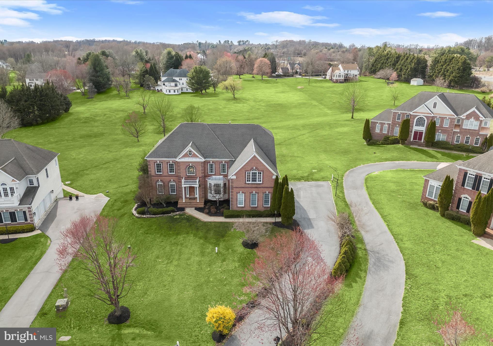 Exquisite Brick Front Colonial in West Friendship’s Prestigious Twin Pines Community.
Nestled in the highly sought-after Twin Pines community of West Friendship, this stunning brick-front colonial offers over 8,000 square feet of refined living space. Meticulously updated with three new HVAC systems (2022), a renovated gourmet kitchen, a new water heater, premium KitchenAid stainless steel appliances, an expansive Trex deck, and more, this home is the epitome of luxury and comfort. A sun-drenched open floor plan welcomes you, featuring a dramatic two-story family room with a soaring vaulted ceiling, gleaming hardwood flooring, and a gas fireplace framed by breathtaking Palladian windows. The gourmet kitchen is a chef’s dream, boasting an oversized island breakfast bar with a gas cooktop, sleek granite countertops, rich wood cabinetry, and stainless appliances including dual wall ovens. The adjoining morning room, filled with natural light, provides access to the deck, creating the perfect space for seamless indoor-outdoor living. Formal living and dining rooms exude elegance, highlighted by intricate accent molding and an impressive coffered ceiling. A private home office, powder room, and spacious laundry room add convenience to the main level. The primary suite is a luxurious retreat, offering a spacious sitting room, a bonus room with cathedral ceilings and closets, and a spa-like en suite bath with a dual vanity, soaking tub, and separate shower. Two additional bedrooms are adjoined by a stylish dual-entry full bathroom, while a fourth bedroom enjoys its own private full bath, completing the upper level. Designed for both grand entertaining and comfortable living, the walkout lower level features a recreation room with a stacked stone fireplace and pellet stove, a custom bar, and a dedicated home theater room. This level also includes an additional bedroom, full bathroom, bonus room, and ample storage space. Outside, the expansive Trex deck and shaded brick patio overlook breathtaking, picturesque views, offering the perfect setting for serene outdoor living. Ideally located near major commuter routes, with easy access to premier shopping, dining, and entertainment, this extraordinary estate seamlessly blends timeless elegance with modern luxury. Schedule your private tour today.