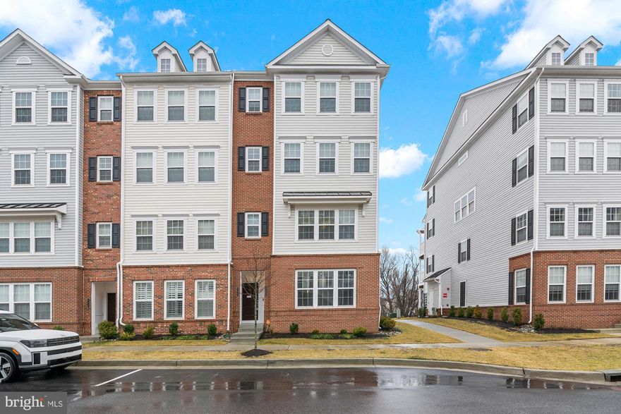 ****This home qualifies for 100% finacining and $10,000+ closing credits with a qualifying loan application.*** Step into a lifestyle of effortless luxury and contemporary comfort in this sun-drenched, two-level condo-style townhome perfectly situated in the vibrant Ballard Green community of Owings Mills. Imagine starting your morning in an expansive, open-concept main level where rich hardwood floors lead you through a gourmet kitchen featuring sleek granite countertops and premium stainless steel appliances—the perfect setting for hosting friends or enjoying a quiet evening at home. As you head upstairs, you’re greeted by a versatile loft-style secondary living room, a bright and airy flex space that’s ideal for a quiet home office, a cozy media lounge, or your morning yoga routine. Retreat to your private sanctuary in the primary suite, complete with a generous walk-in closet and a spa-inspired ensuite bath featuring a double vanity and a deluxe glass-enclosed shower. With the ultimate convenience of bedroom-level laundry, a private rear deck for summer grilling, and a rare attached one-car garage, this 2-bedroom, 2-bathroom home offers the space and modern finishes you’ve been looking for. Living here means enjoying incredible community amenities like the pool, clubhouse, and fitness center, all while being just minutes from the upscale shopping and dining at Mill Station and the Owings Mills Metro.